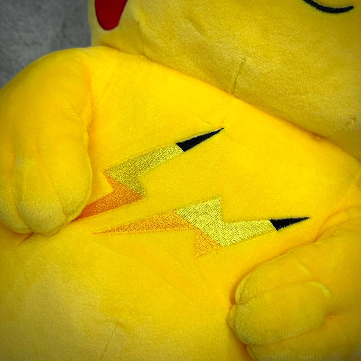 Pokemon x Thunderbolt Project by Fragment Pikachu Plush featuring embroidered lightning bolt design on soft yellow fabric