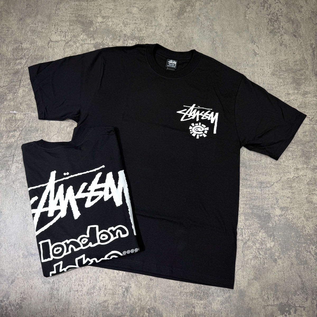 Stussy x Always Do What You Should Do World Tour Tee in black with bold logo design.