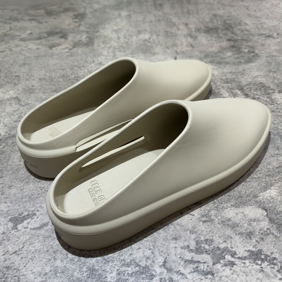 Fear of God The California Slip-on Oat FG80-100EVA showcasing modern luxury lounge footwear in minimalistic design.