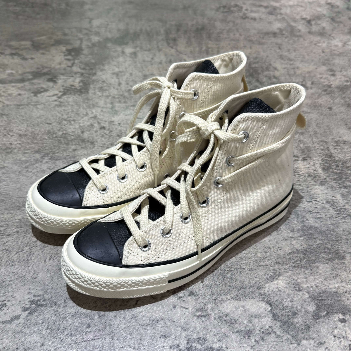 Fear Of God Essentials x Converse Chuck 70s Hi - White / Grey high-top sneakers with black toe cap.