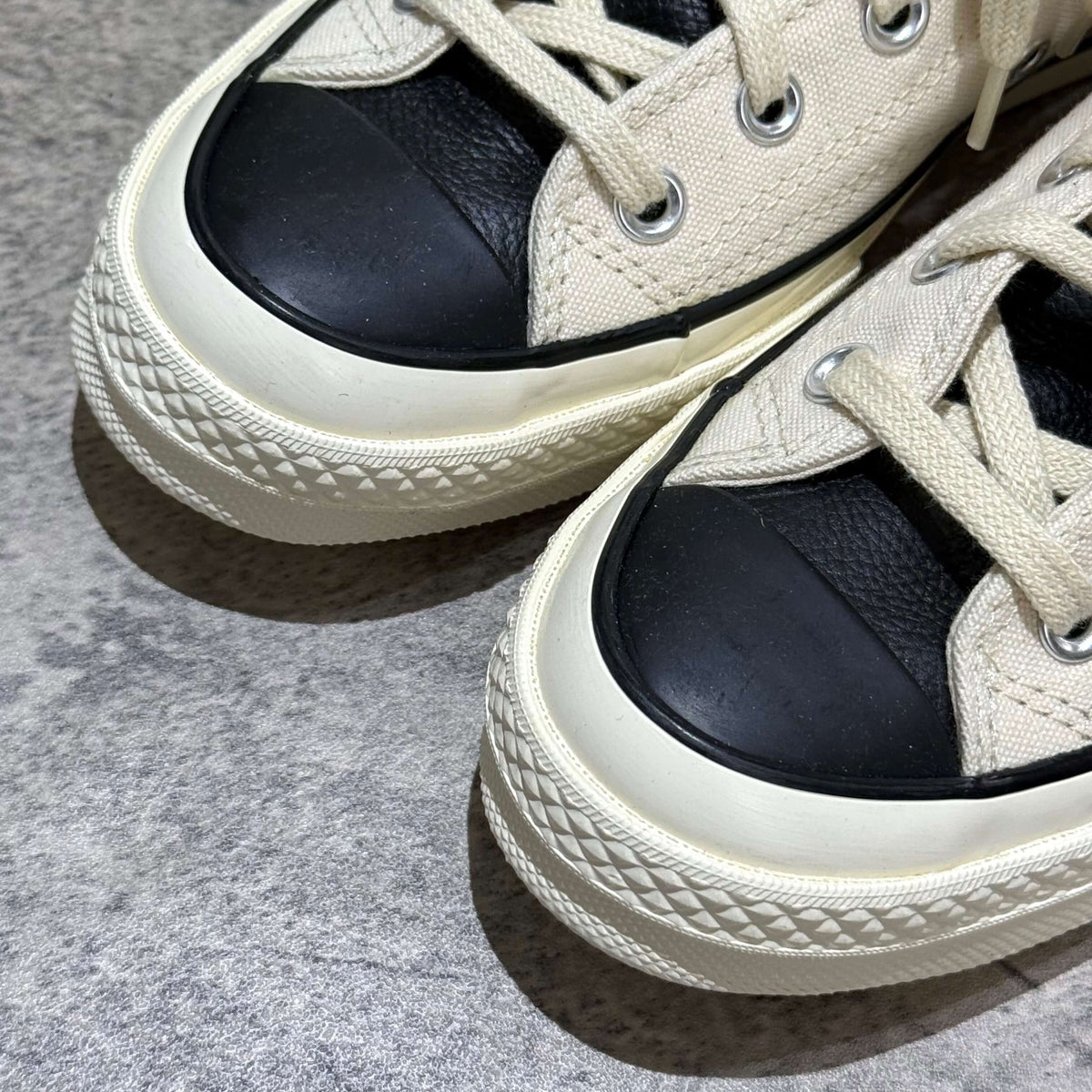 Fear Of God Essentials x Converse Chuck 70s Hi - White / Grey close-up view showing the sneaker's toe and lace details.