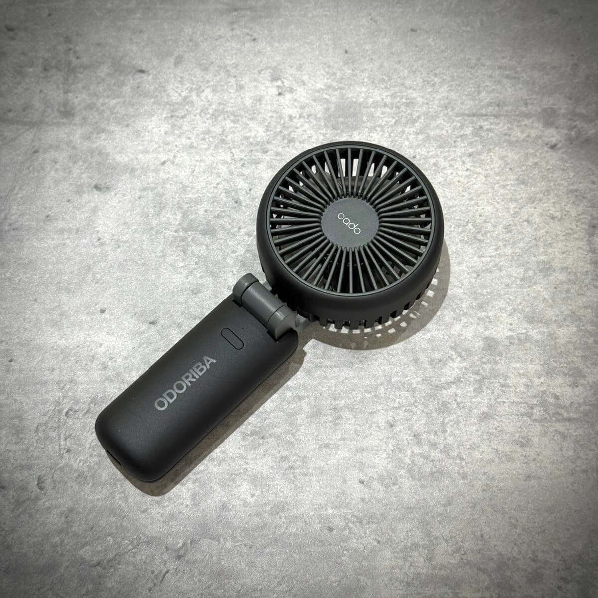 Fragment Design x Cado Mini Handy Fan in sleek black design with compact structure and powerful airflow.