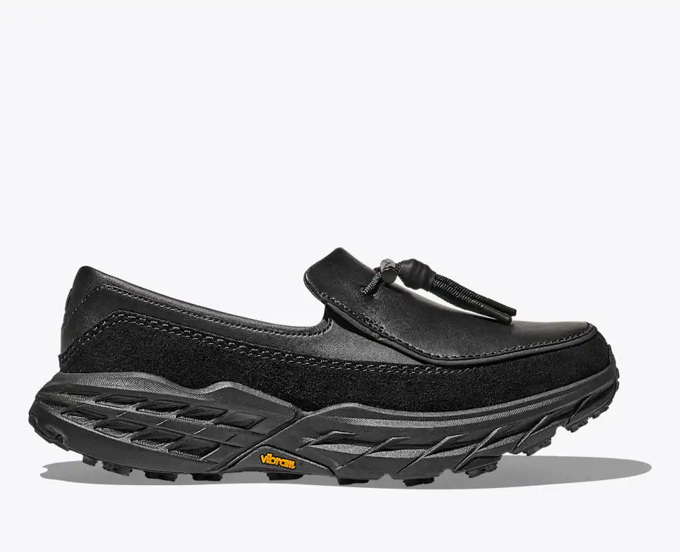 Hoka Speed Loafers - Black 1162170-BBLC side view showcasing sleek design and Vibram outsole.