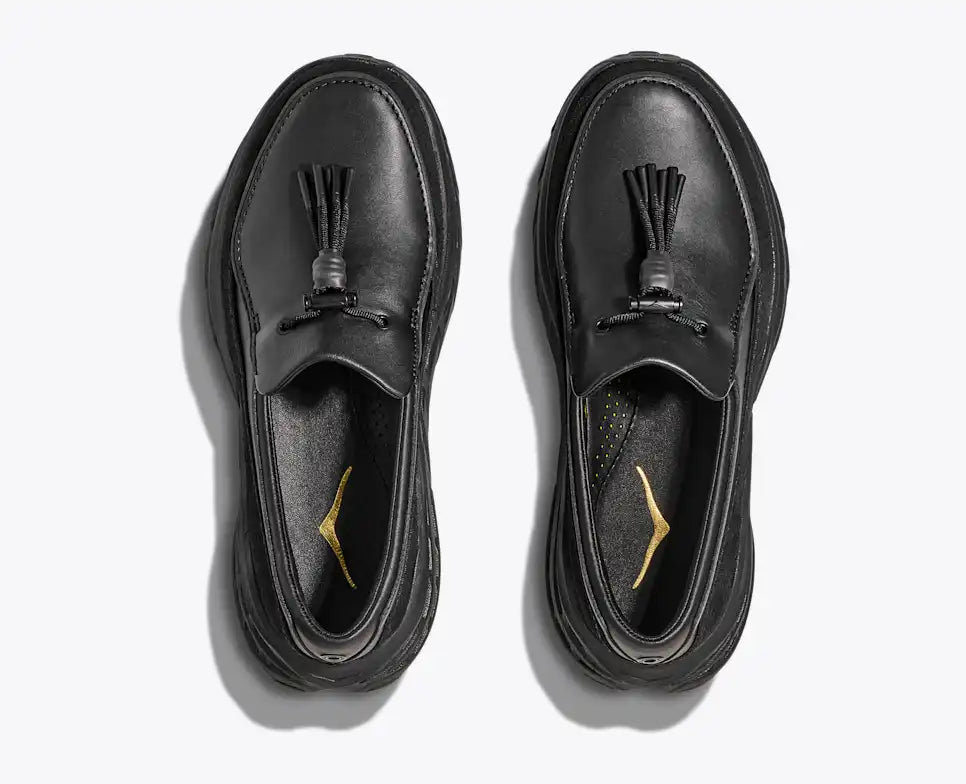 Hoka Speed Loafers - Black 1162170-BBLC top view, showcasing sleek black leather design and tassel detail.