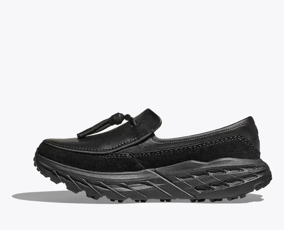 Hoka Speed Loafers - Black 1162170-BBLC side view showcasing stylish design and rugged traction.