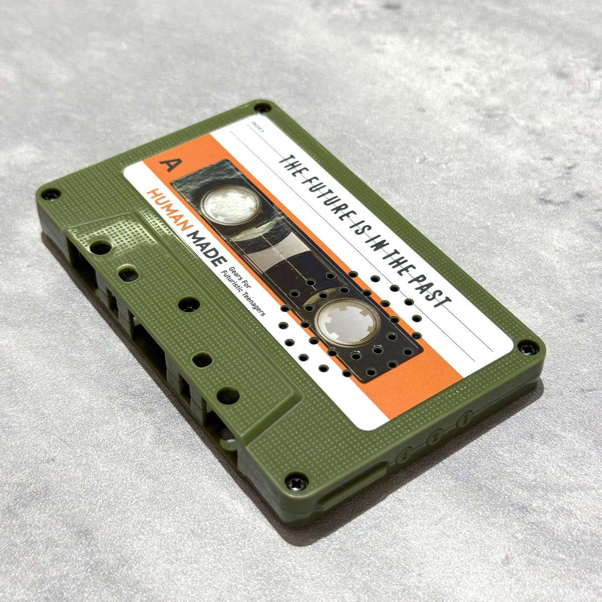 Human Made Cassette Speaker featuring retro design with orange and green casing.