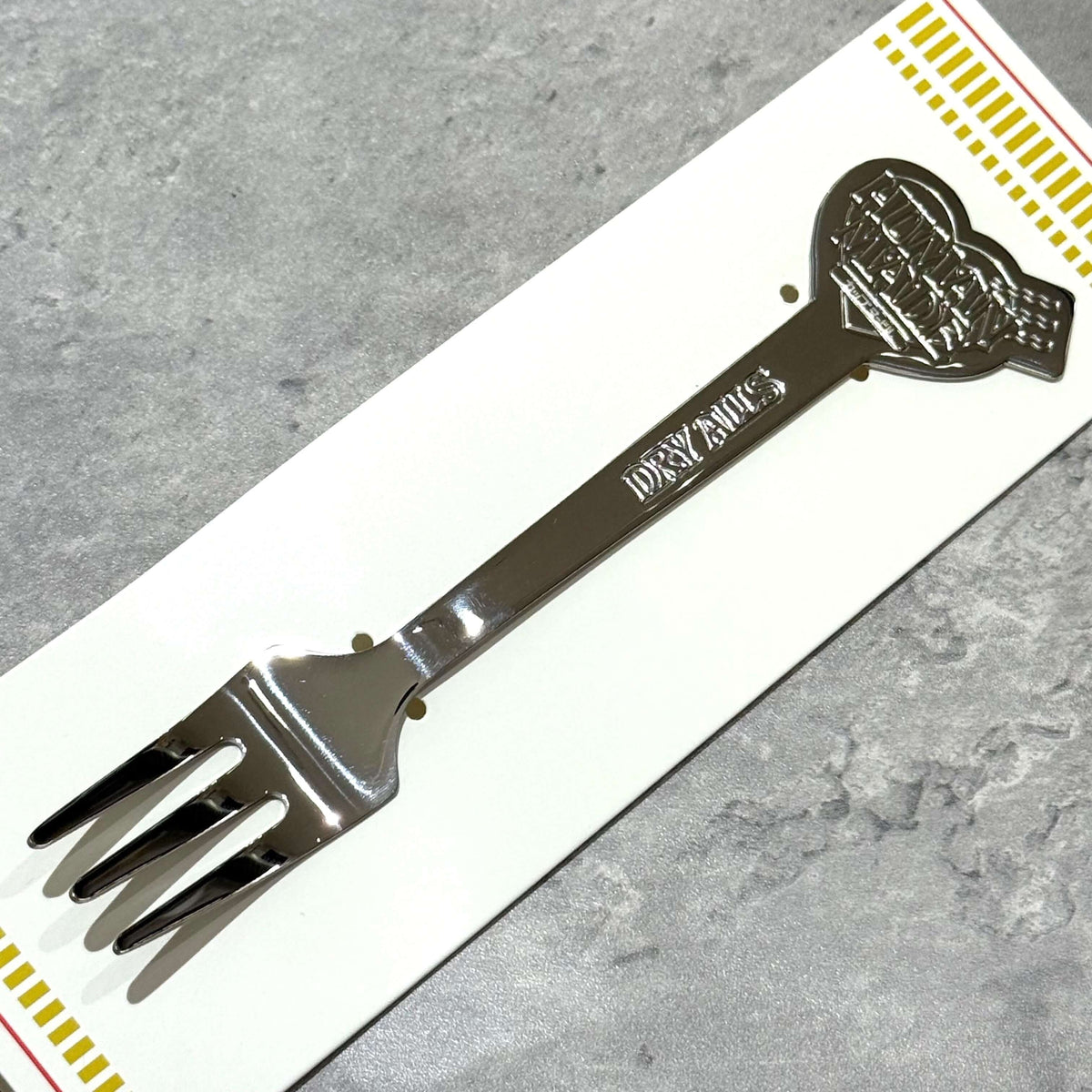 Human Made Cup Noodle Fork on a display card, showcasing its unique design and collectible appeal.