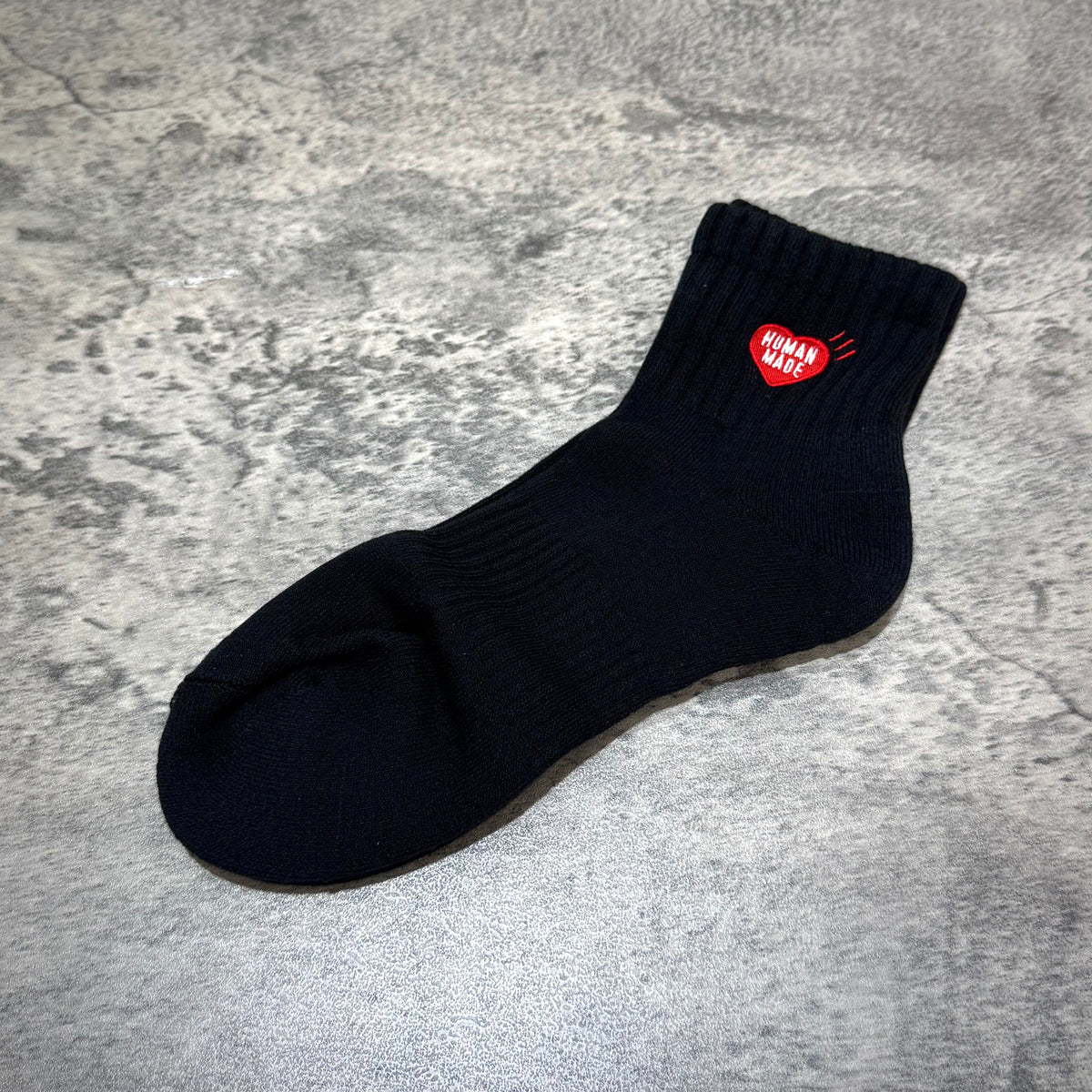 Human Made Pile Short Socks HM00GD009 in black with red heart logo on top.