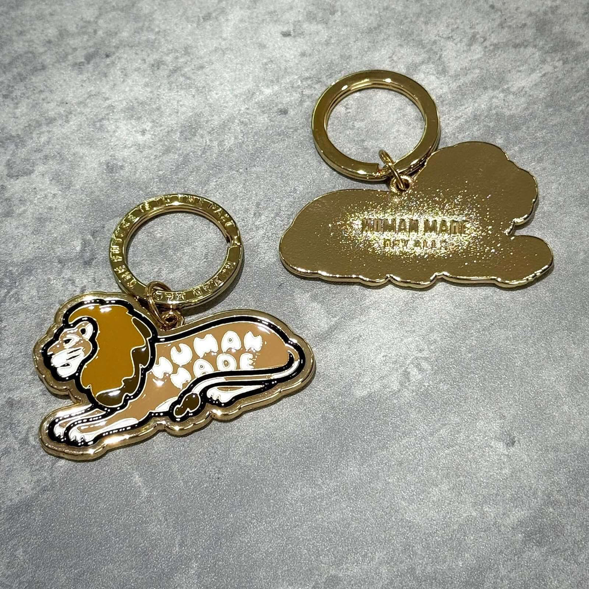 Human Made Tokyo Exclusive Lion Keychain featuring a lion design and gold finish.