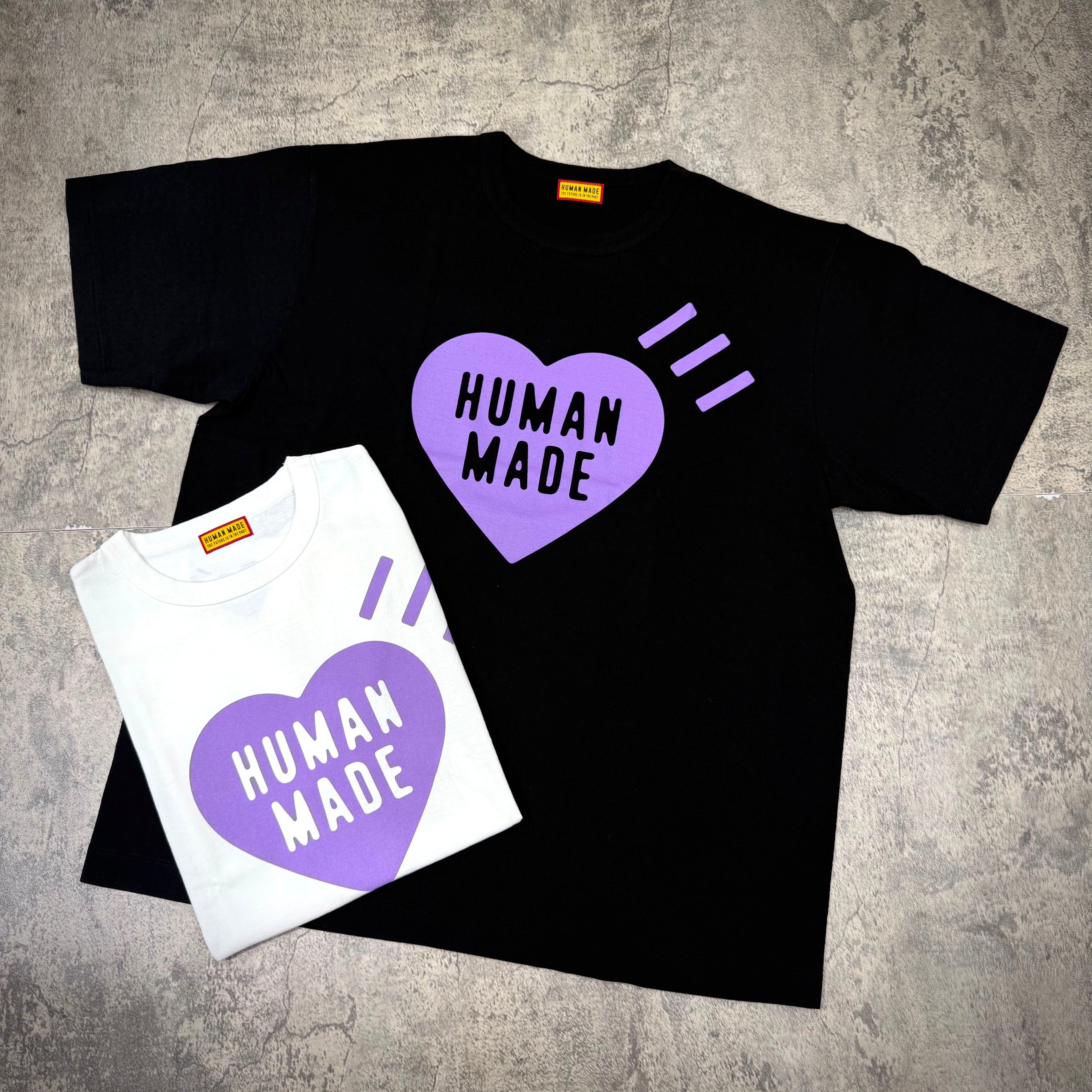 Human Made Apgujeong Exclusive Heart Logo Tee in black and white with heart design.