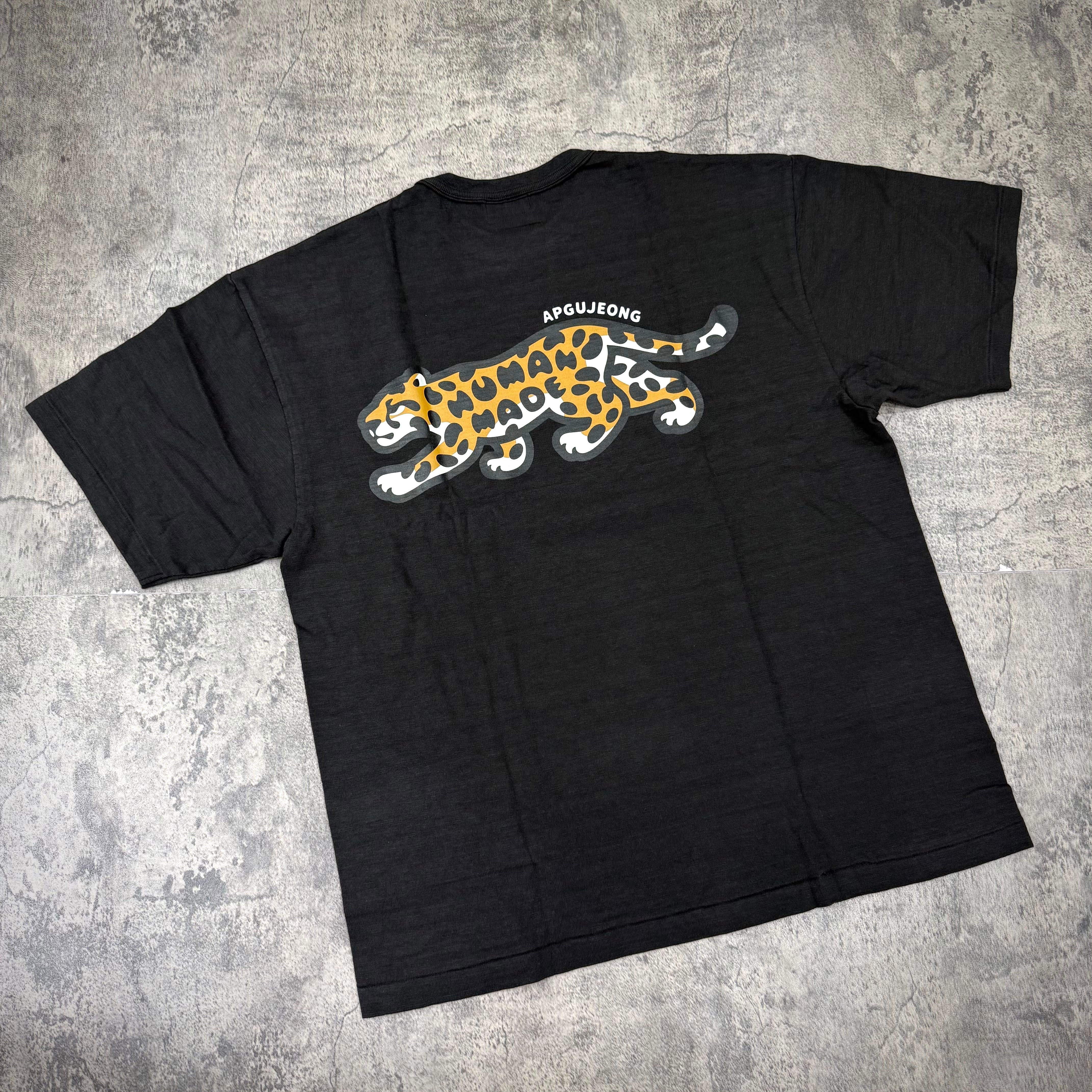Human Made Apgujeong Exclusive Leopard Back Logo Tee showcasing leopard print design on the back.