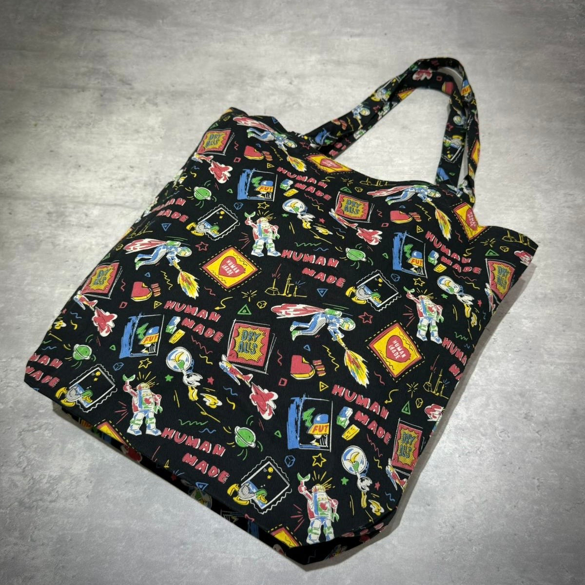 Colorful Human Made Book Tote with playful graphics and stylish design, perfect for carrying books and essentials.