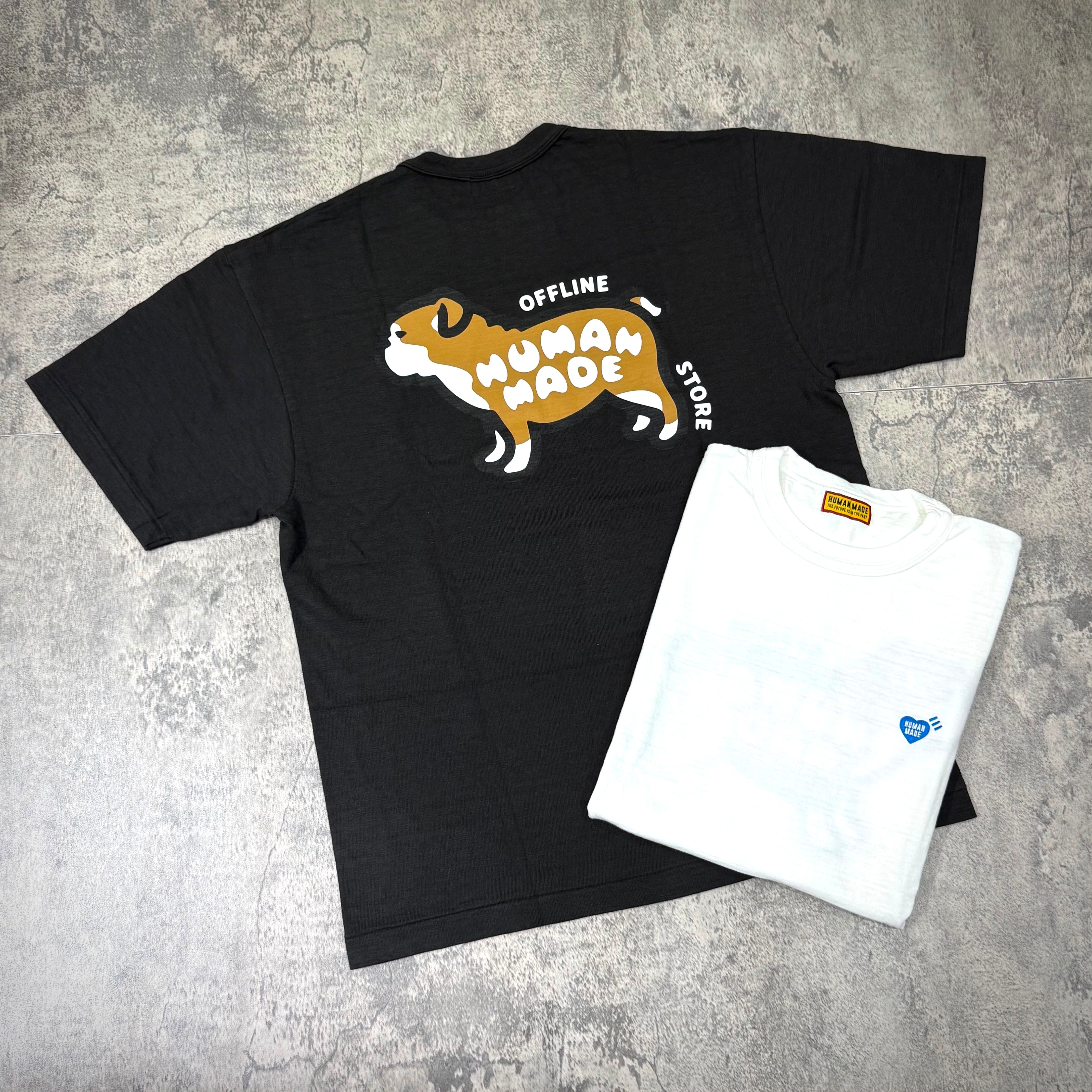 Human Made Gaien offline Exclusive Bull Dog Back Logo Tee displayed with a white tee on a textured surface.