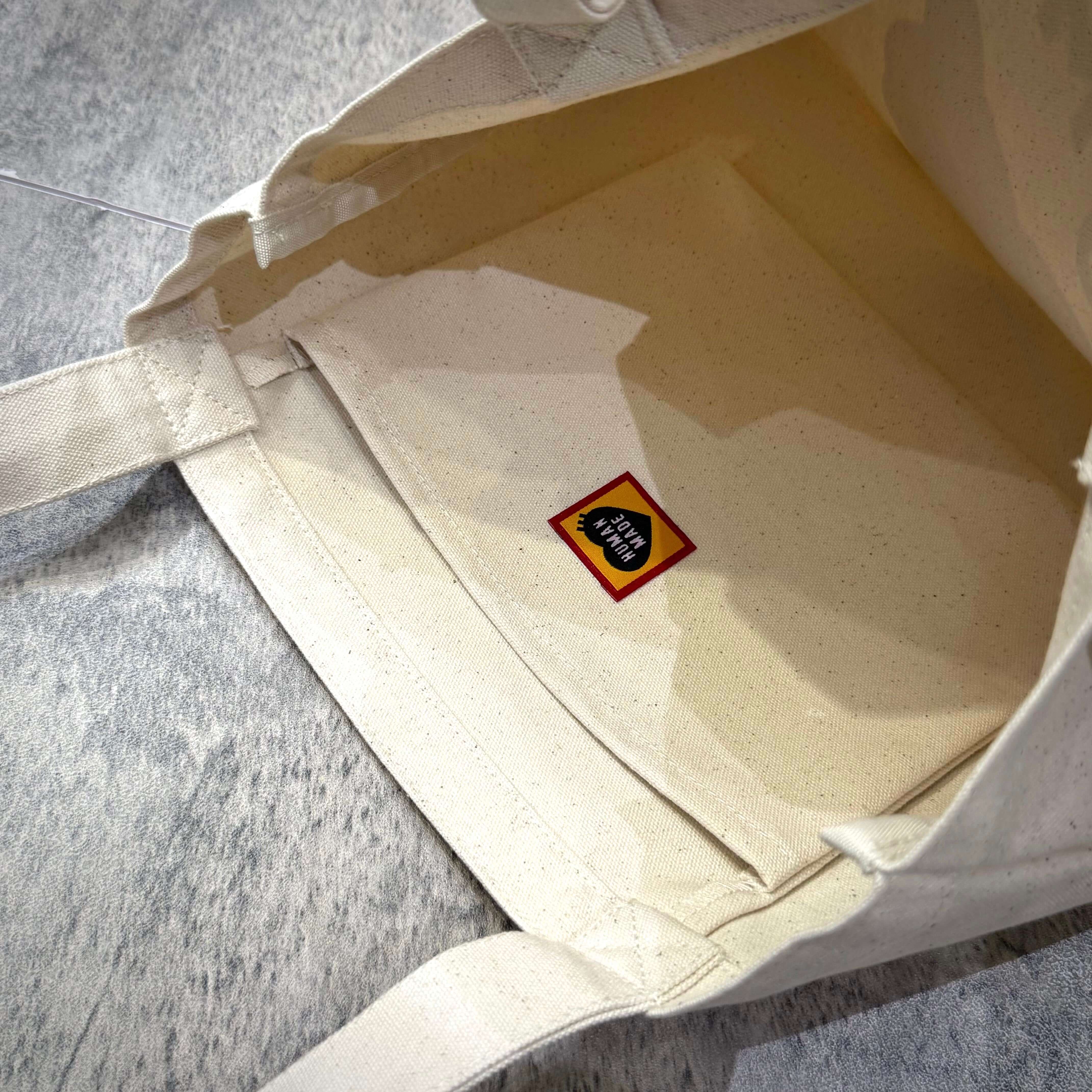 Interior view of the Human Made Jamsil Exclusive Book Tote showing the brand logo.