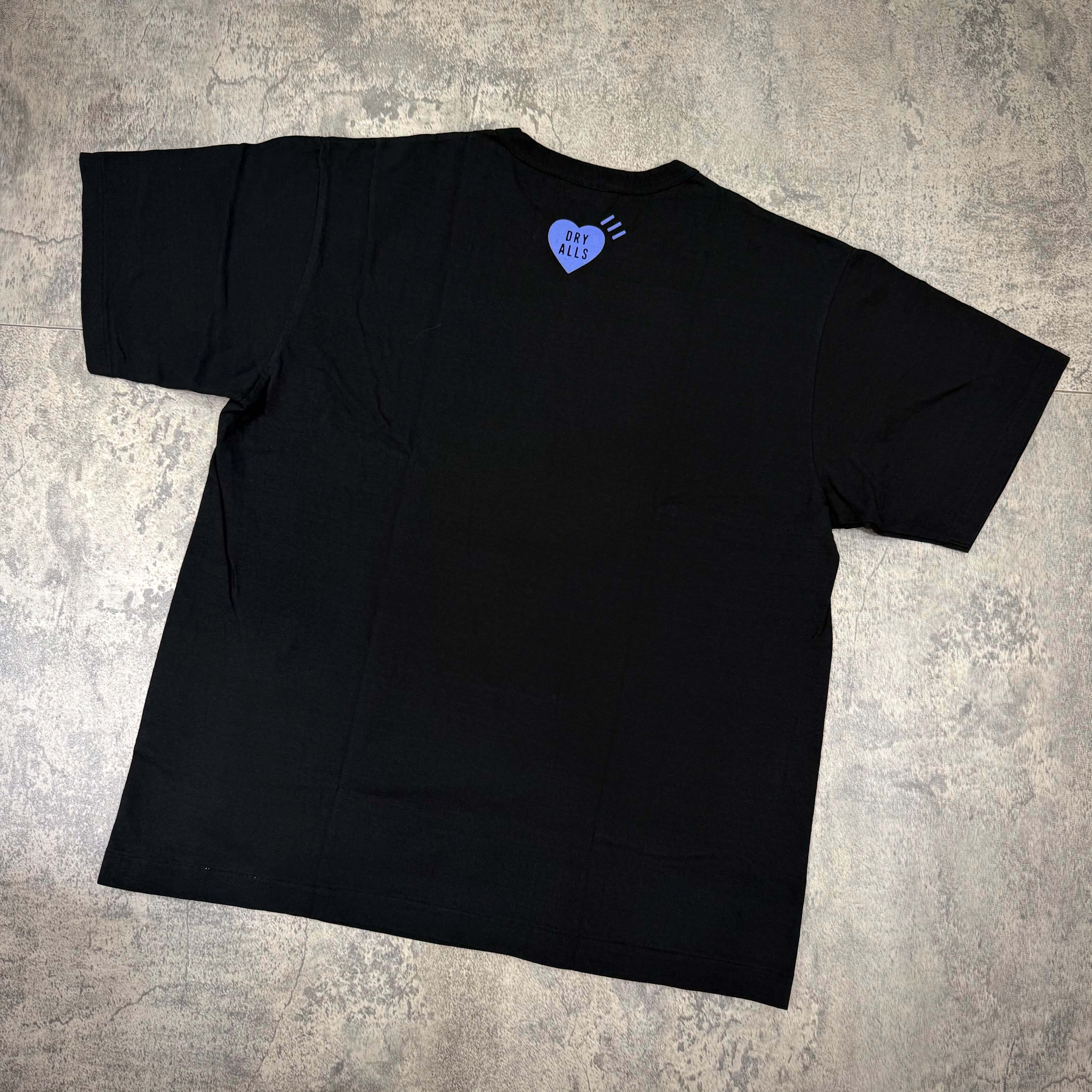 Human Made Jamsil Exclusive Heart Logo Tee featuring a heart logo on the back of a black t-shirt.