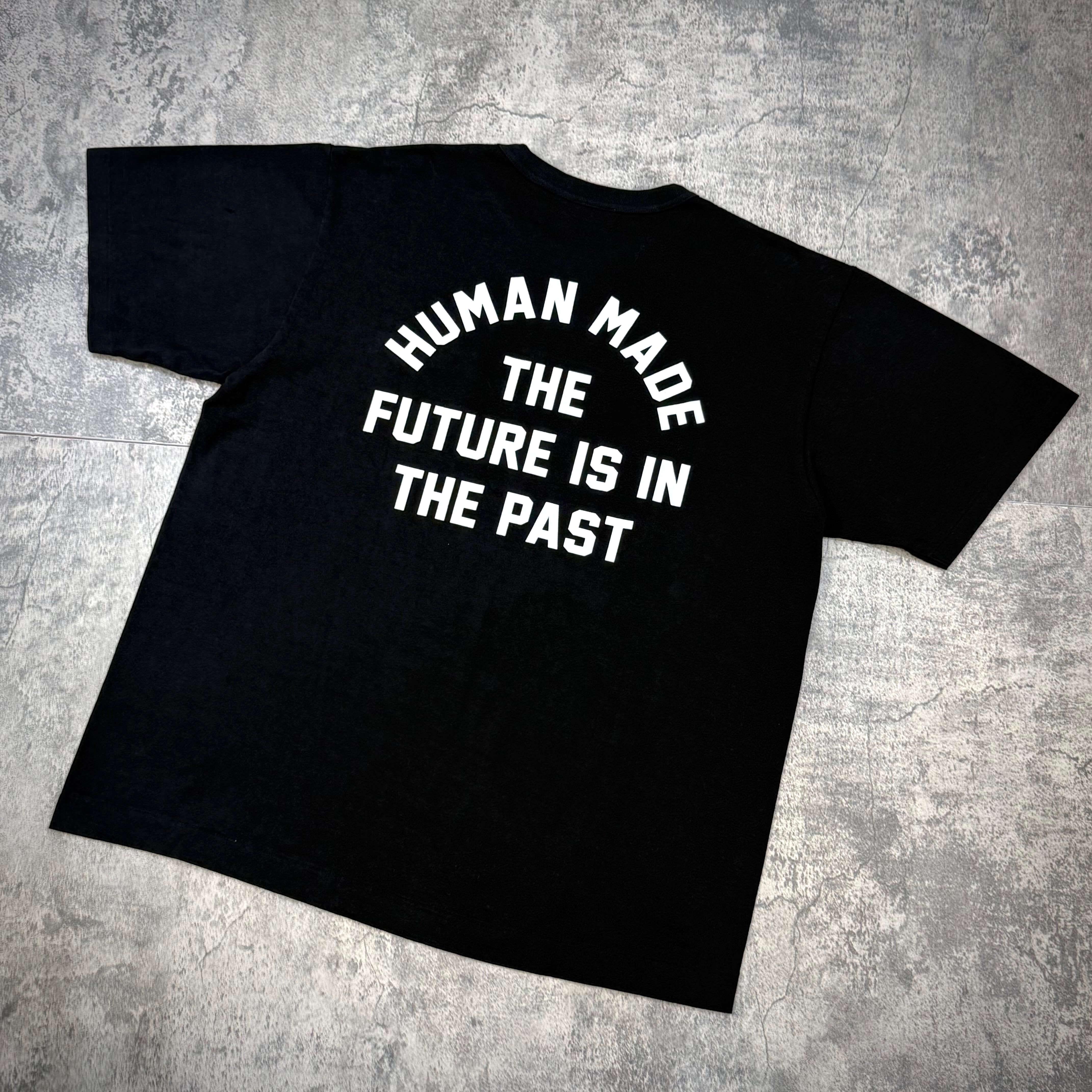 Human Made Jamsil Exclusive Heart Pocket Tee featuring a back design with 'THE FUTURE IS IN THE PAST' in bold text.