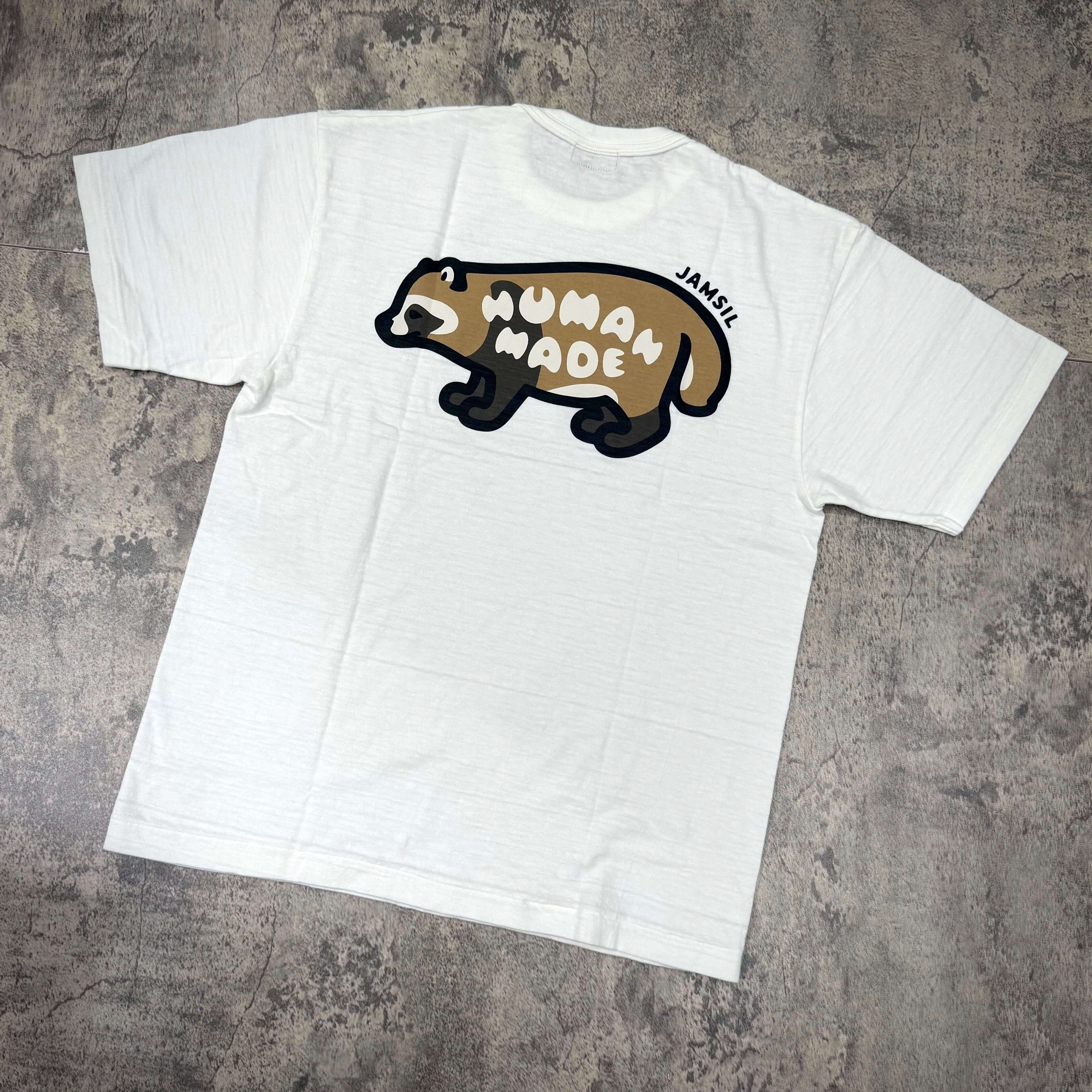 Human Made Jamsil Exclusive Raccon Back Logo Tee featuring a playful raccoon design on a white t-shirt.