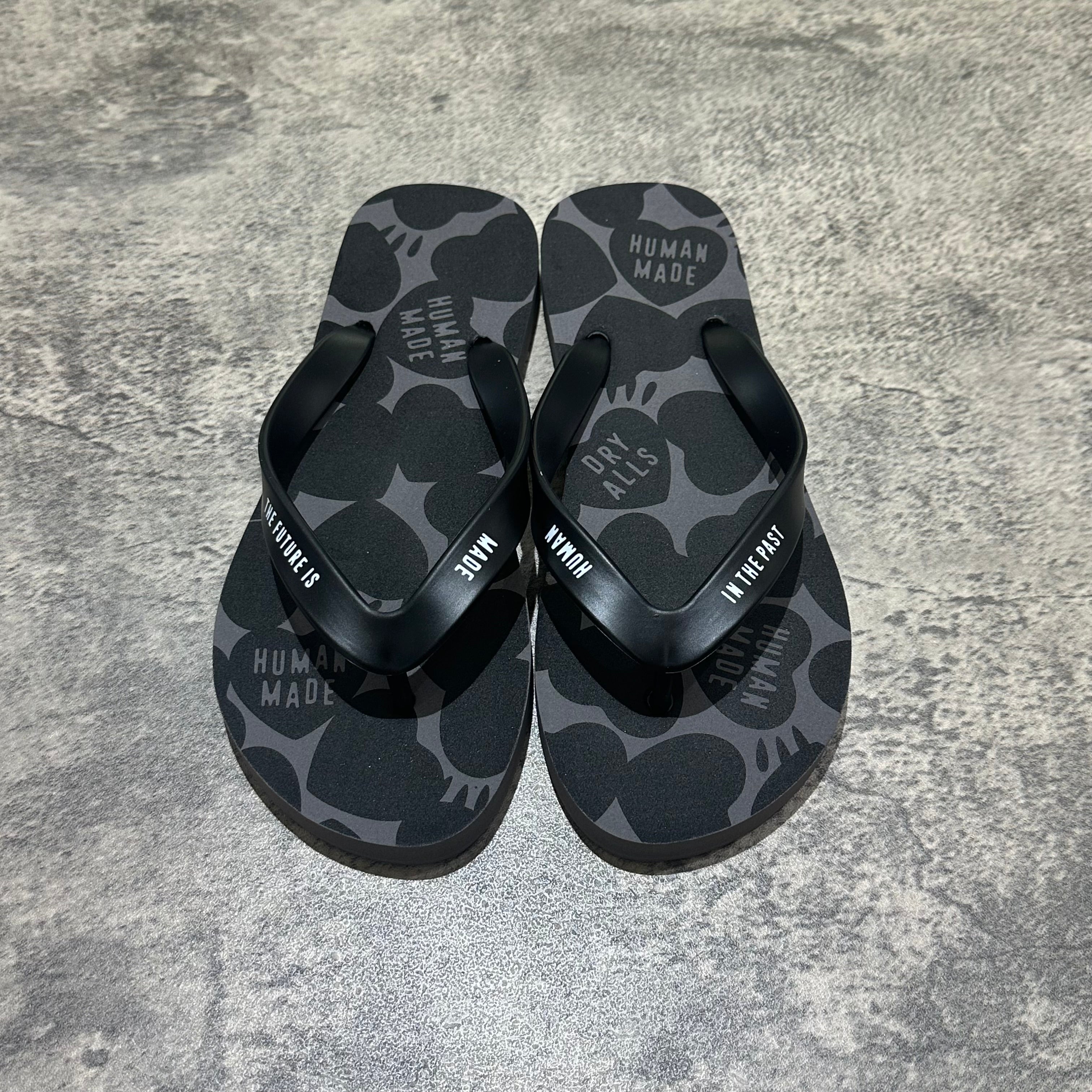 Human Made Sandal featuring a black and gray pattern with a flip-flop design on a textured background.