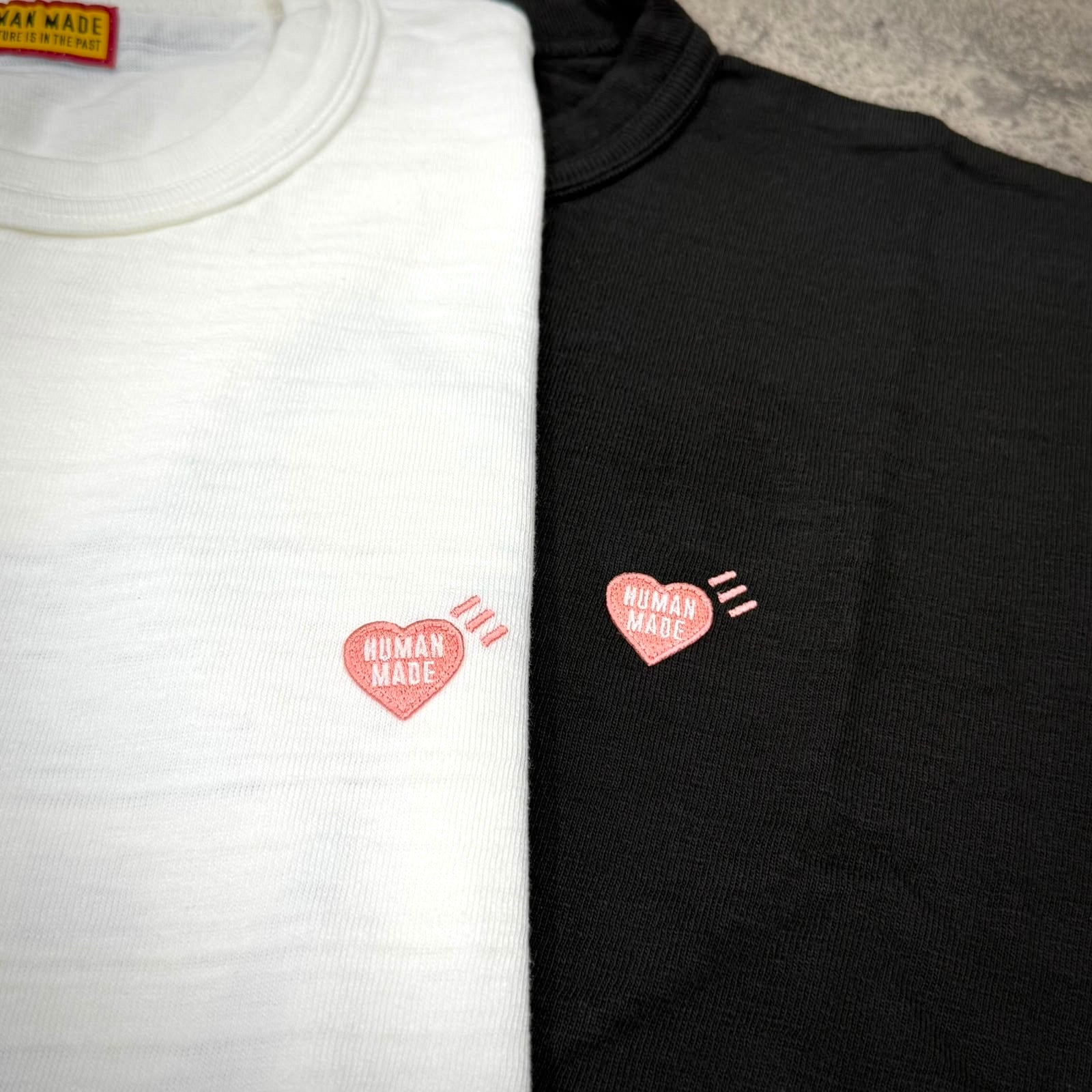 Human Made Seoul Exclusive Jindo Dog Back Logo Tee in white and black featuring heart logo.