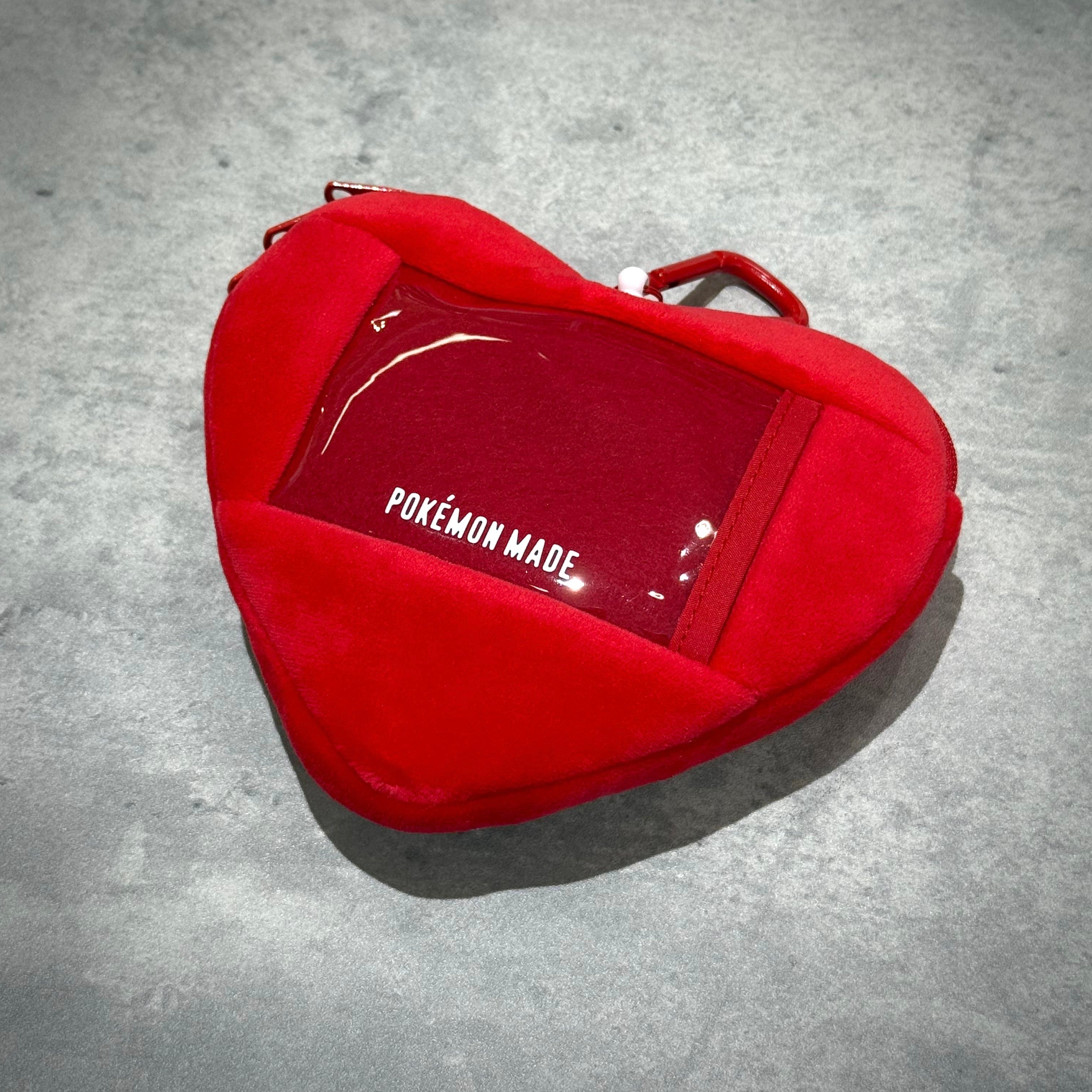Human Made x Pokemon Heart Stuffed Passcase in red plush material with transparent window.