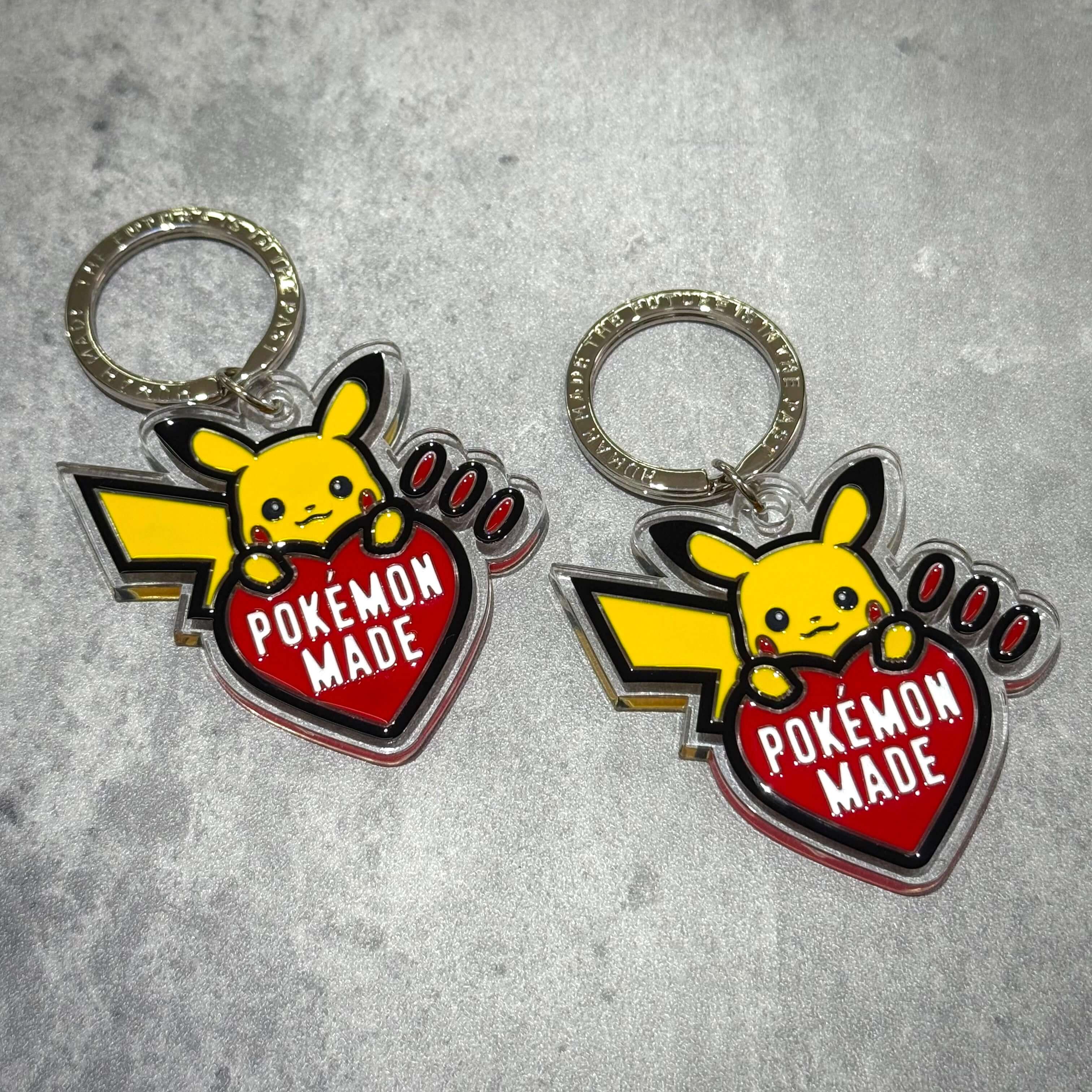 Human Made x Pokemon Keychain featuring Pikachu and a heart design with 'POKEMON MADE' text.