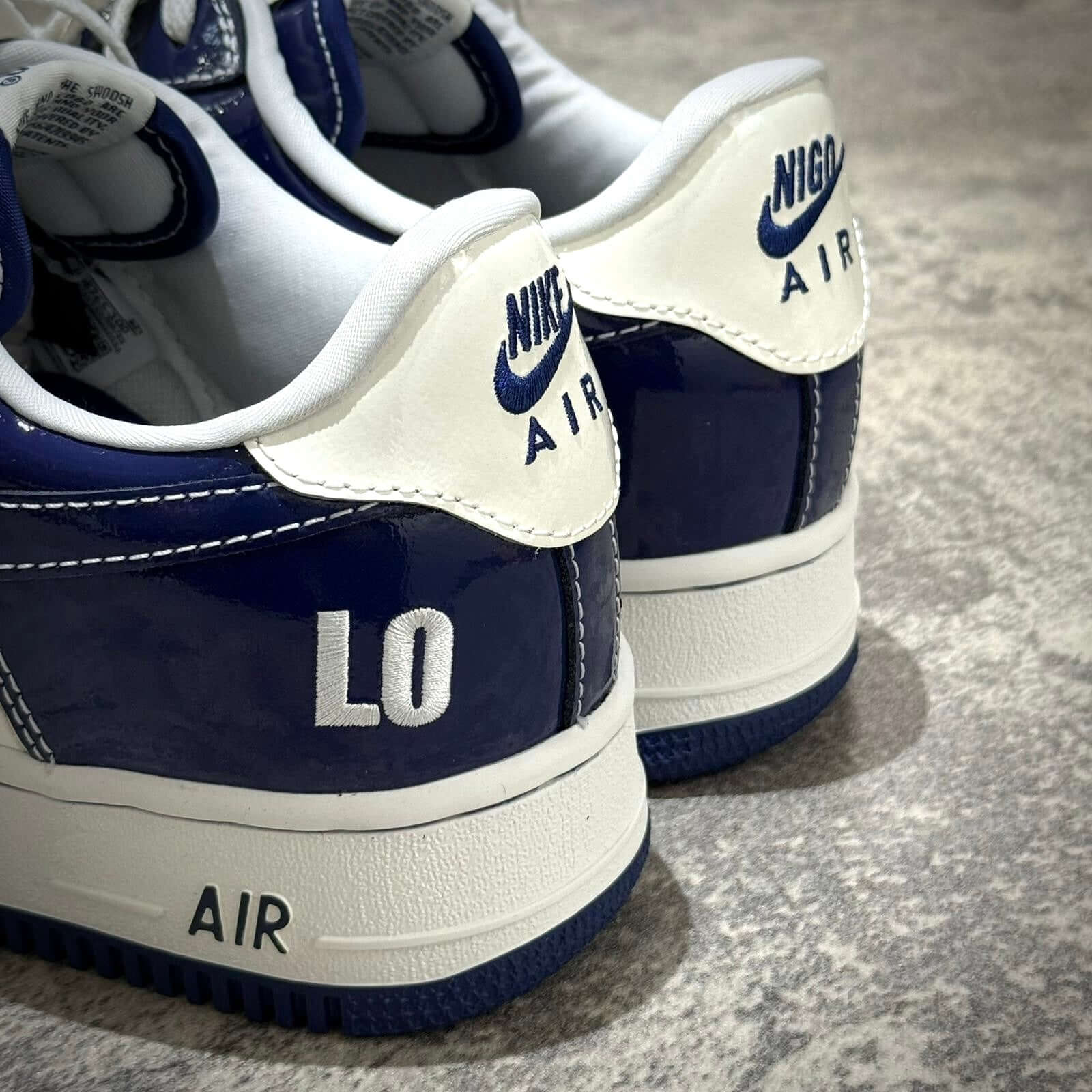 Nigo x Nike Air Force 1 LAST ORGY 2 close-up of the back design with blue and white color scheme.