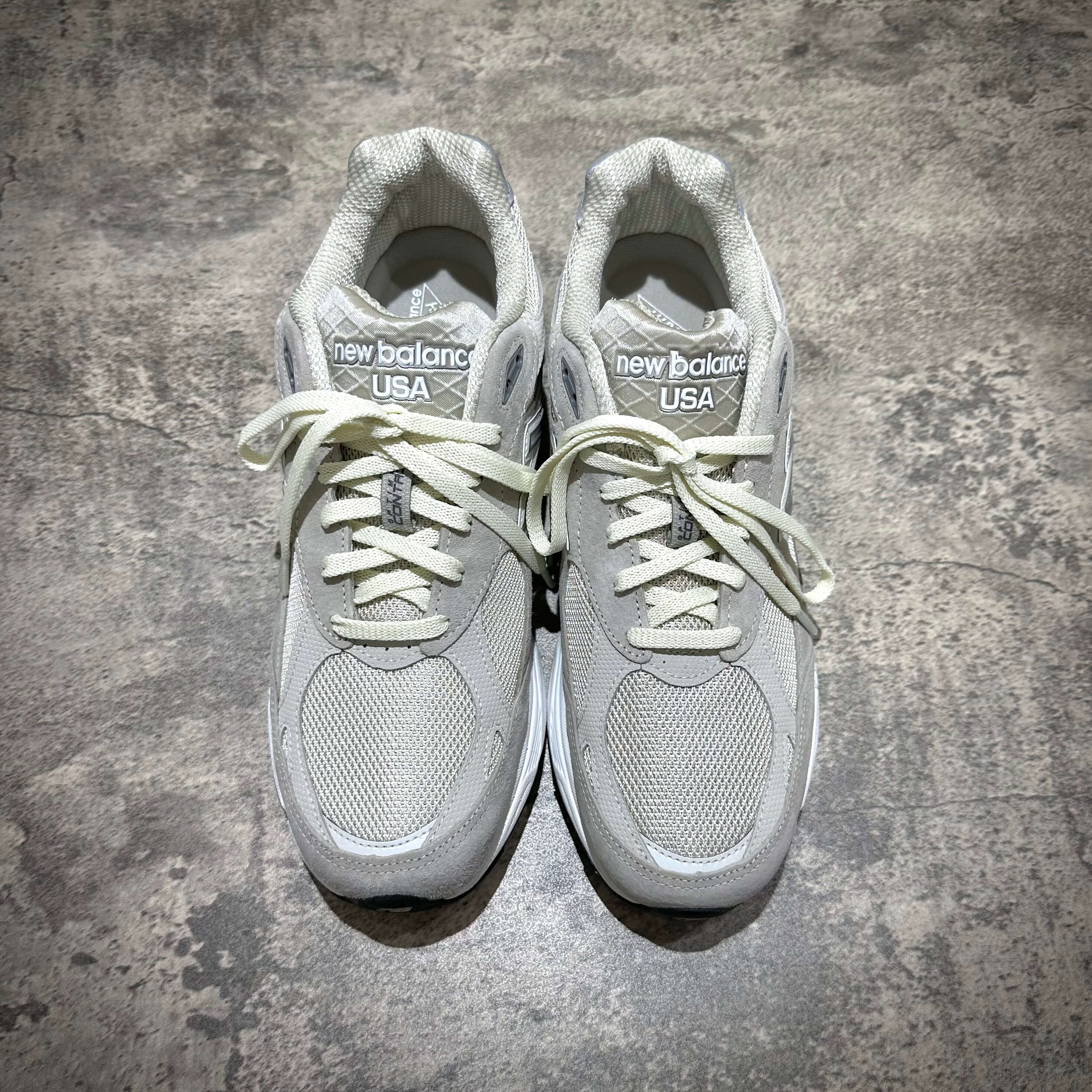 MiUSA Kith x New Balance 990v3 Hallow sneakers in gray color, featuring a textured upper and classic design.