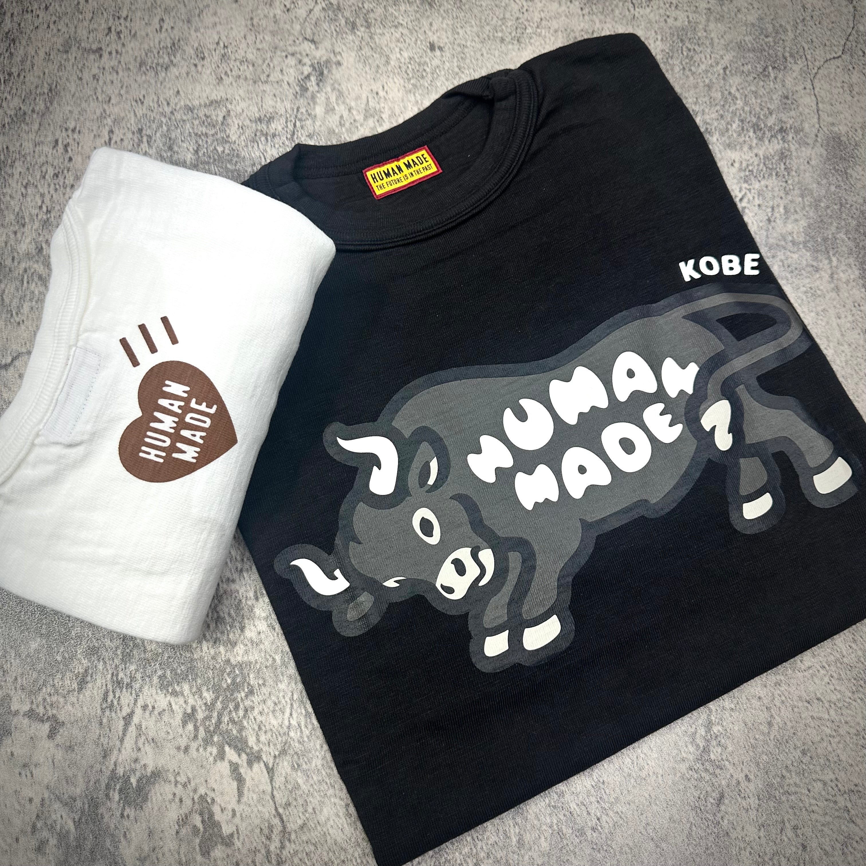 Human Made Kobe Exclusive Bull Graphic Tee displayed with a white t-shirt featuring Human Made logo.