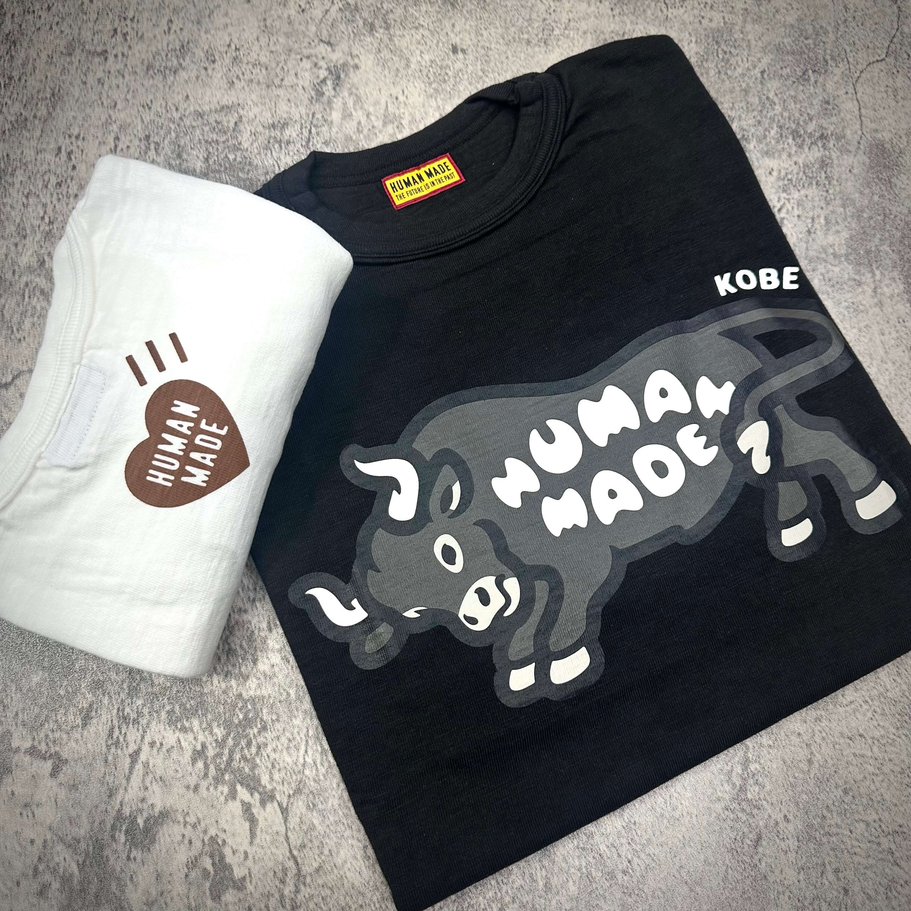 Human Made Kobe Exclusive Bull Graphic Tee displayed with a white t-shirt featuring Human Made logo.