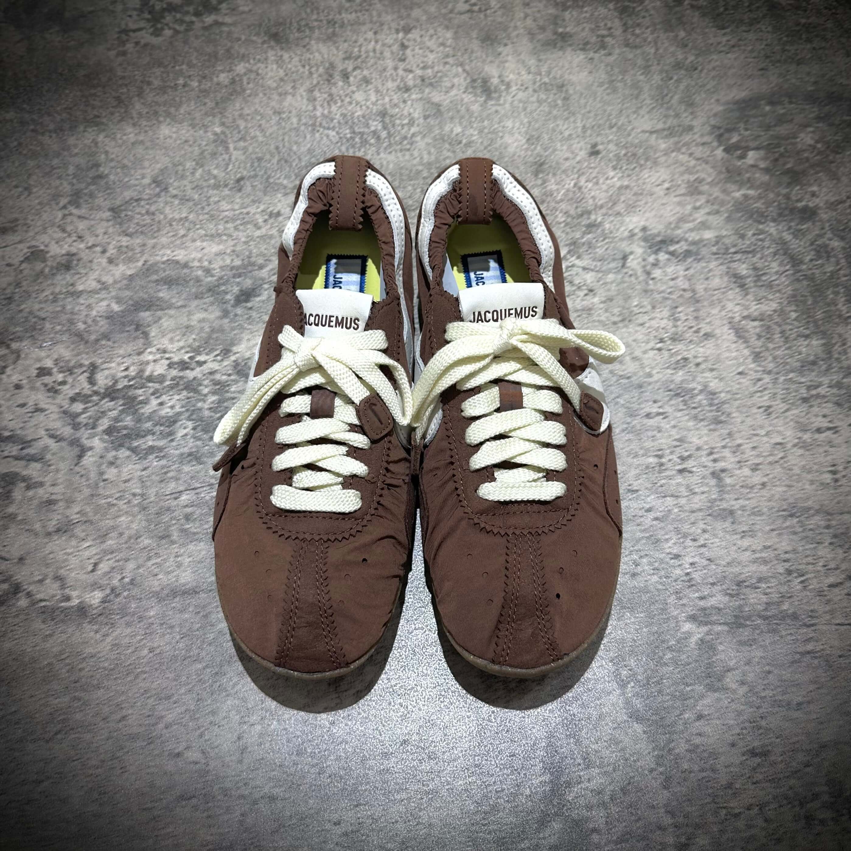 Jacquemus x Nike Moon Shoe SP in Brown, featuring white laces and a stylish design.