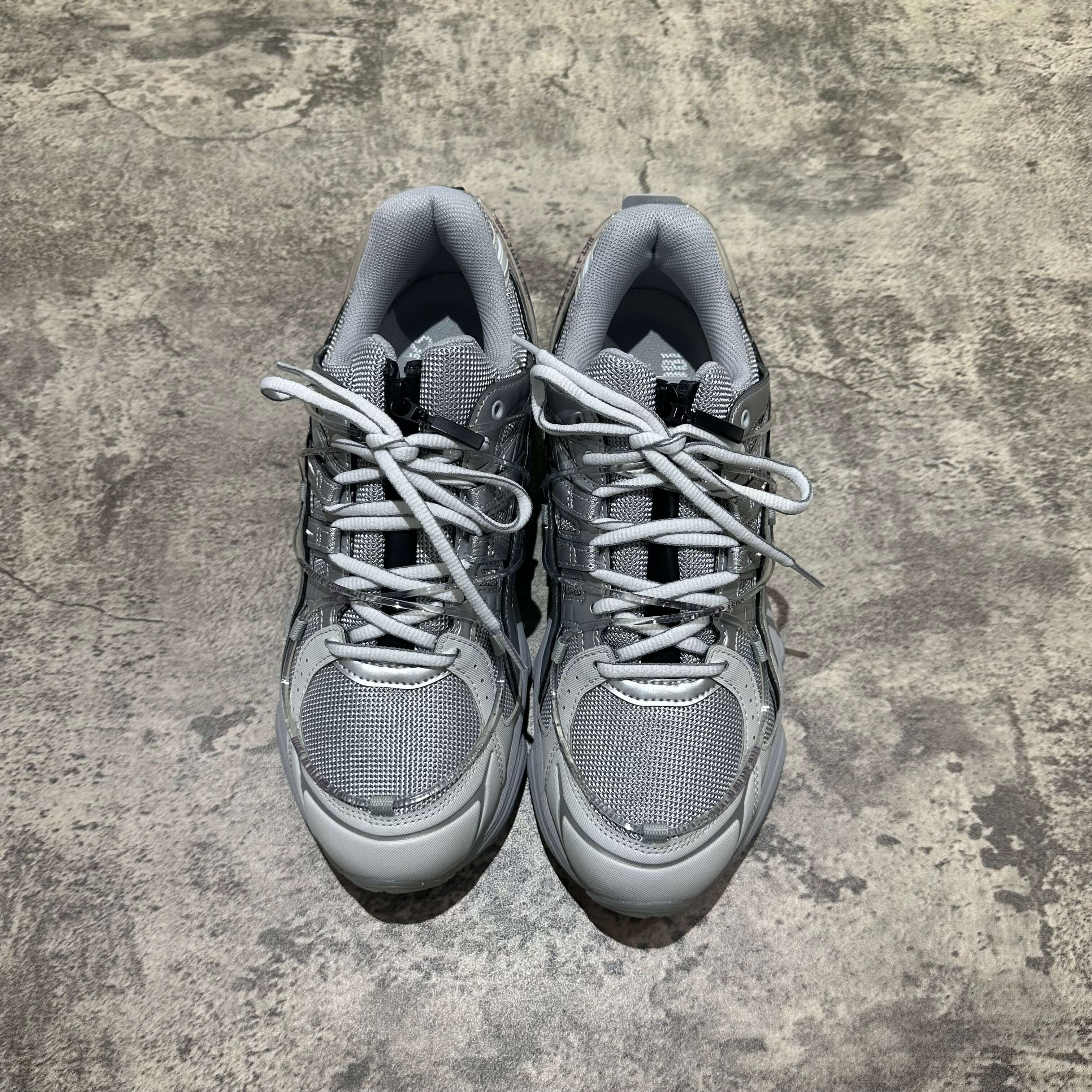 Yoasobi x Asics Gel Kinetic Fluent Y in Piedmont Grey and Pure Silver, top view of the comfortable sneakers.