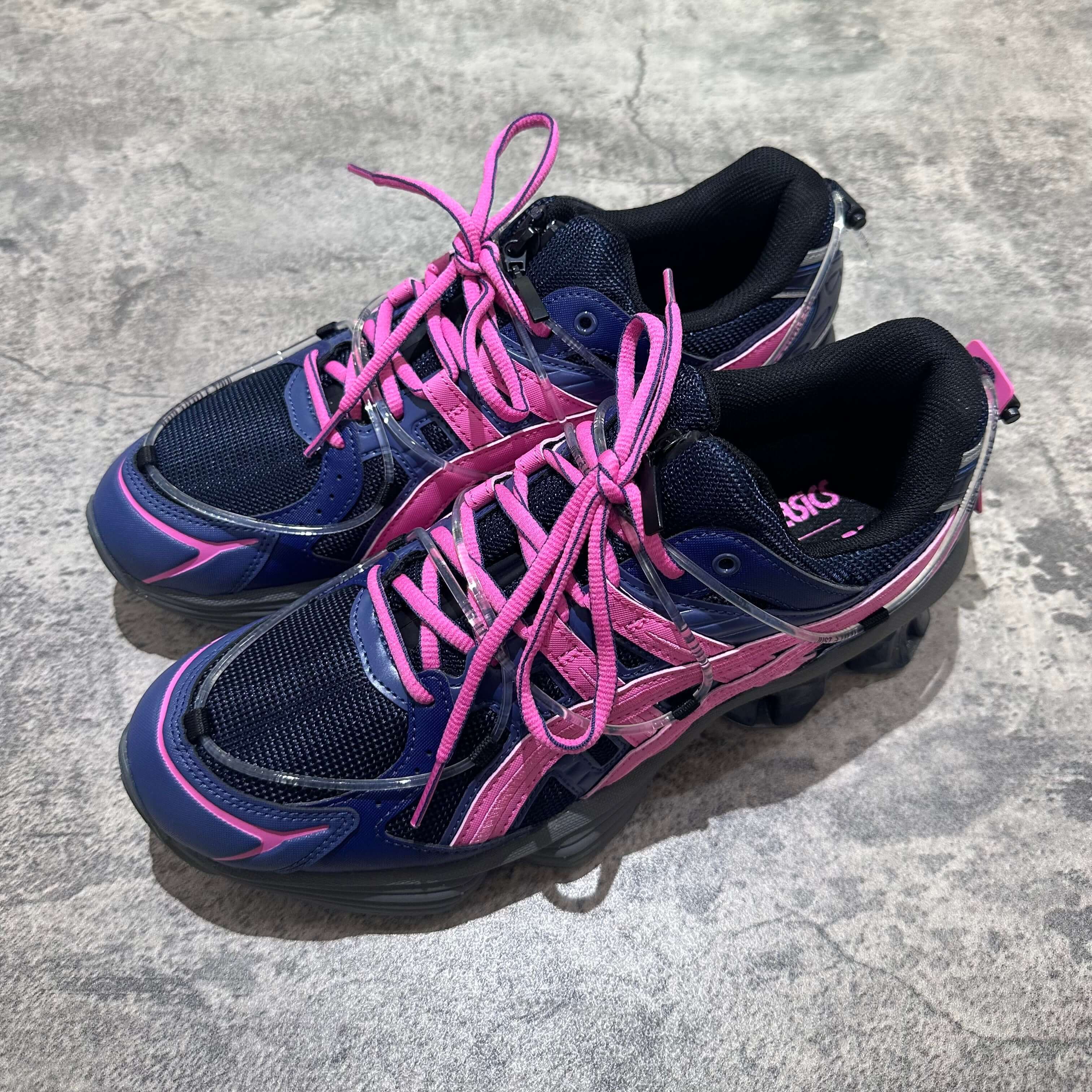 Yoasobi x Asics Gel Kinetic Fluent Y sneakers in Midnight and Dragon Fruit colorway.