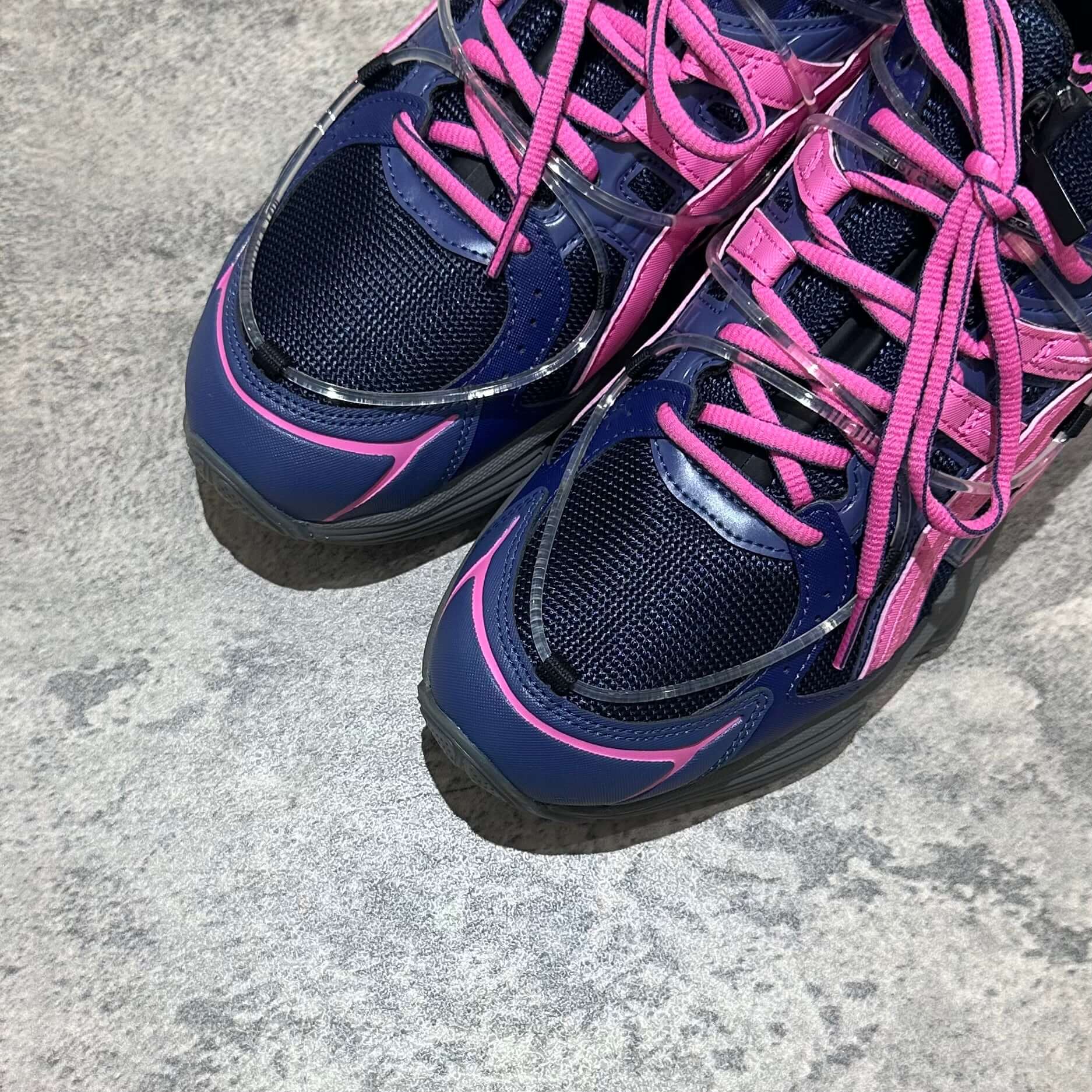 Yoasobi x Asics Gel Kinetic Fluent Y sneakers in Midnight and Dragon Fruit colorway, featuring mesh upper and vibrant laces.