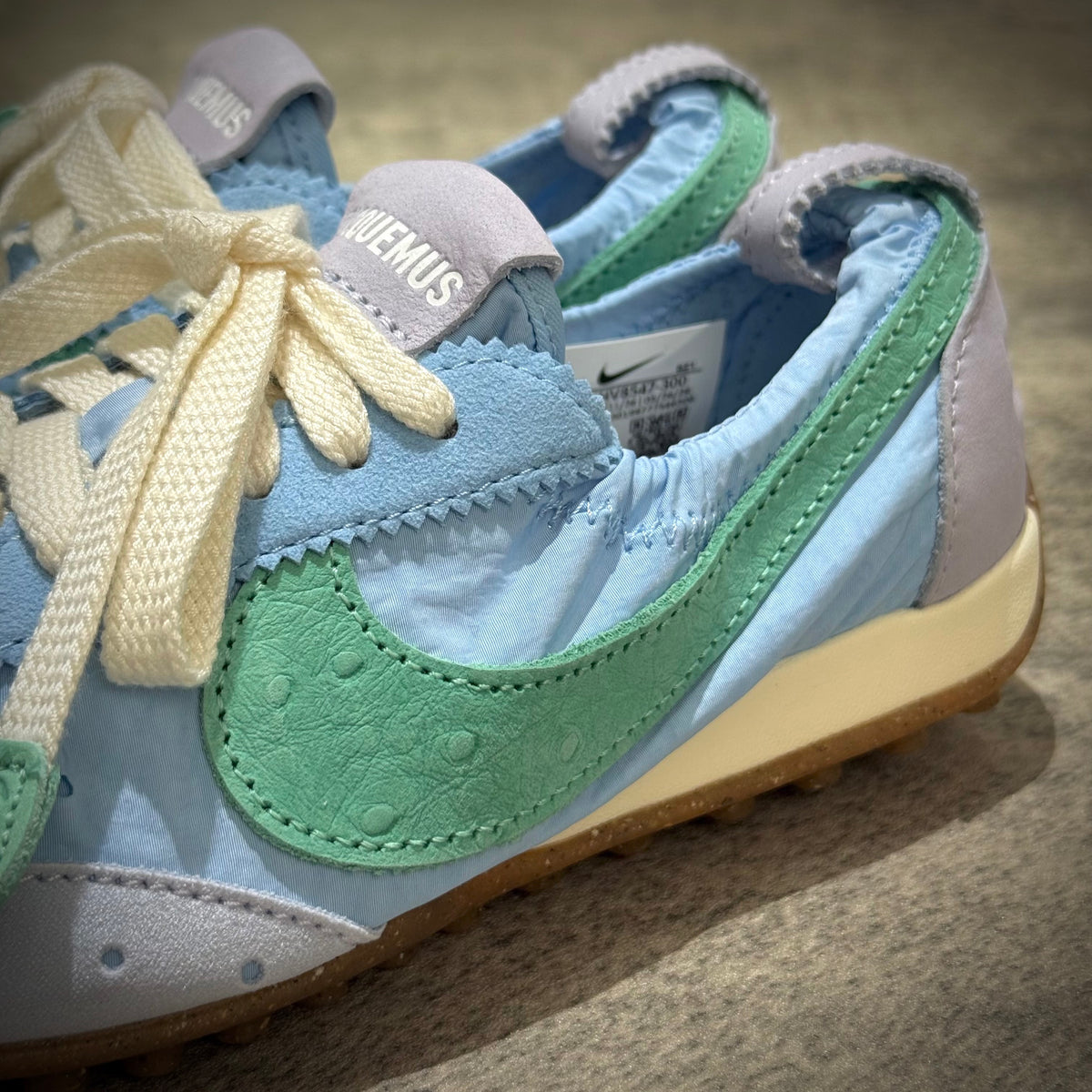 Jacquemus x Nike Moon Shoe SP - Emerald Rise HV8547-300 showing unique colorway with blue and green details.