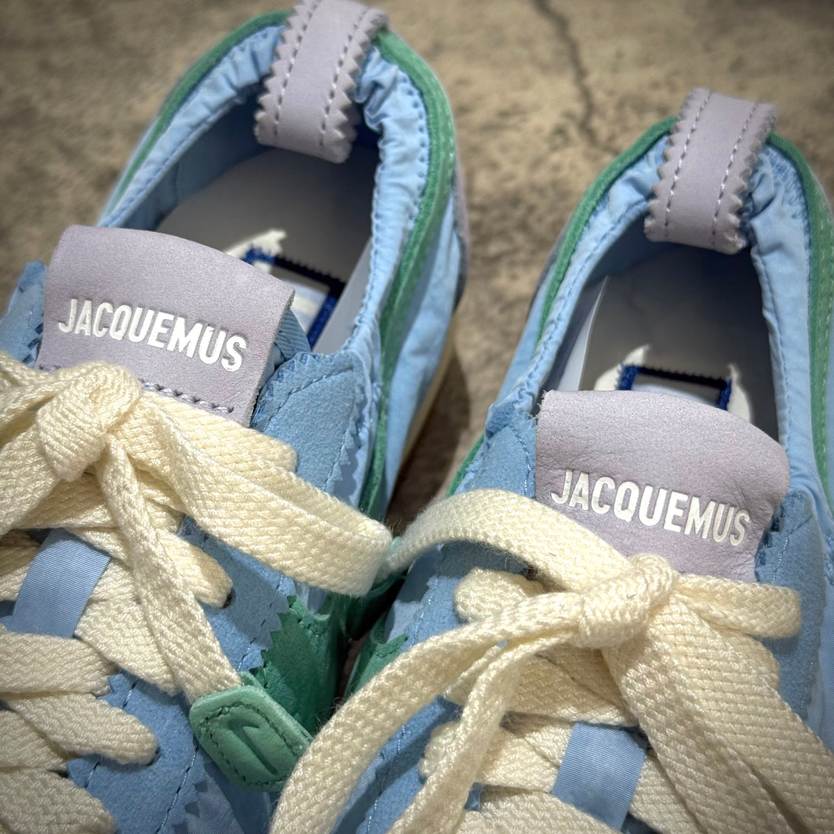 Jacquemus x Nike Moon Shoe SP - Emerald Rise HV8547-300 close-up of shoe details including laces and branding.