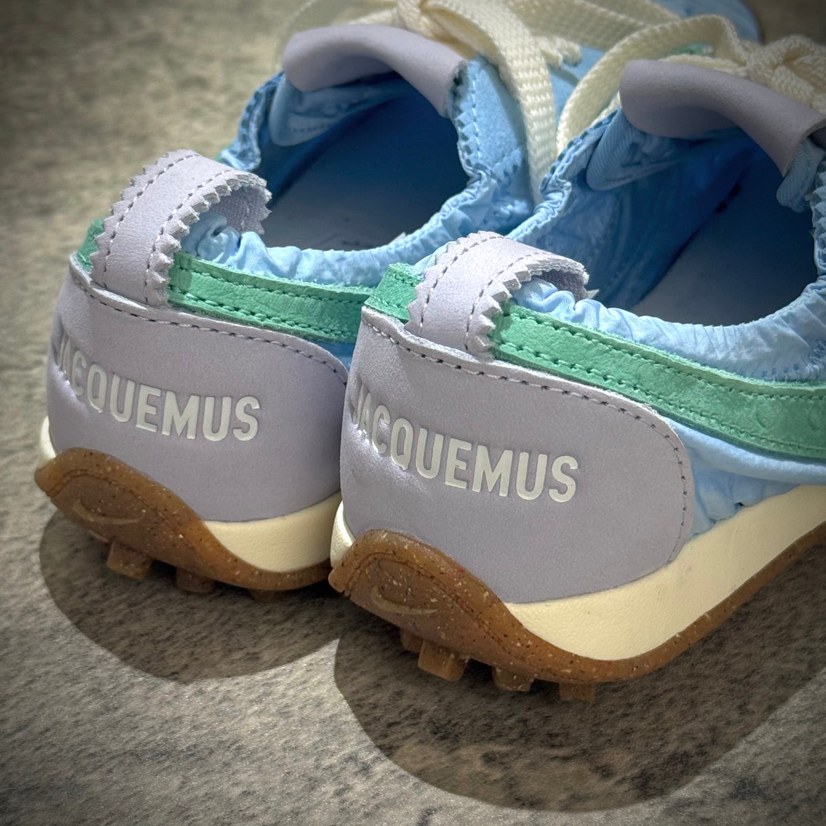 Jacquemus x Nike Moon Shoe SP - Emerald Rise HV8547-300 close-up of the shoe's heel with branding details.