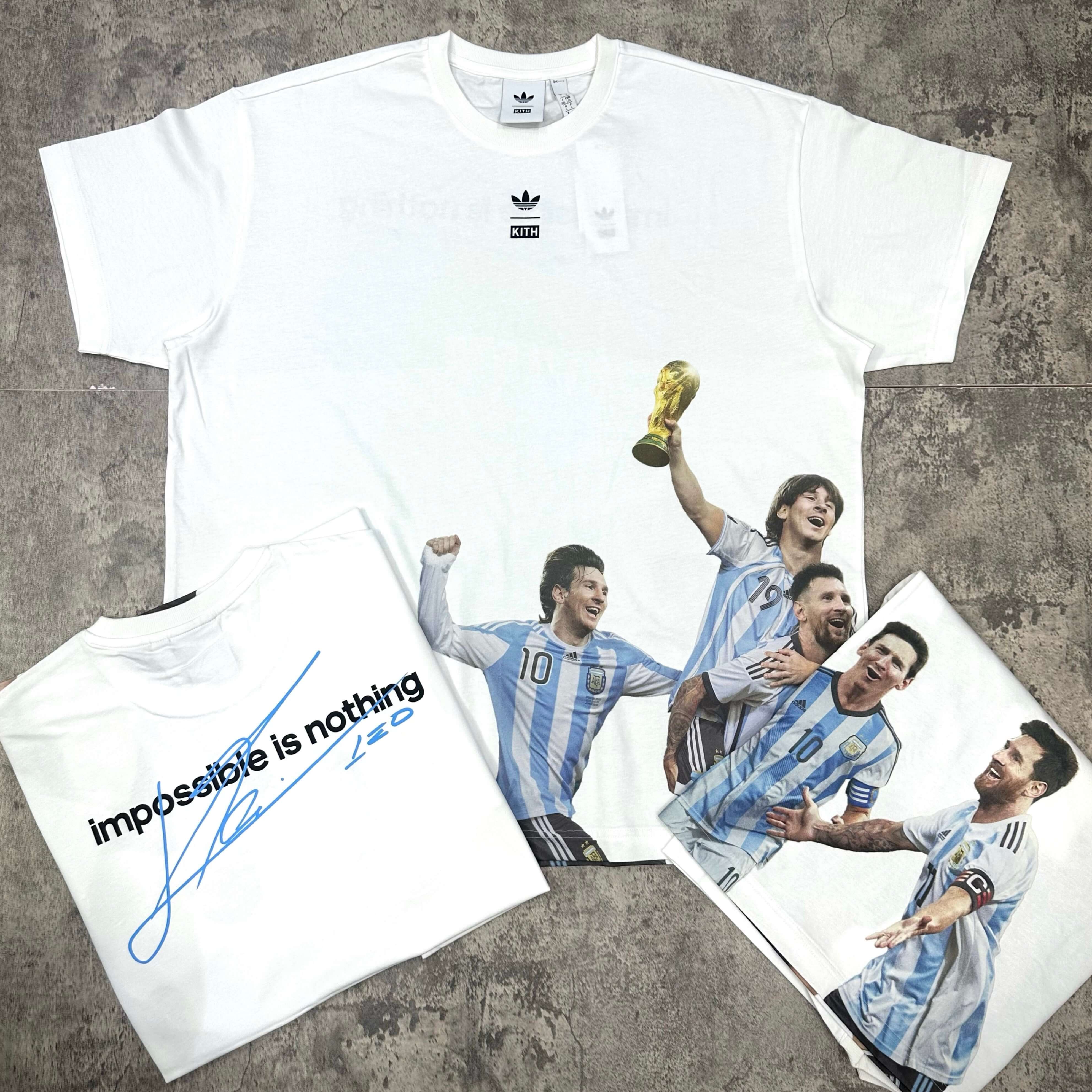 KITH x MESSI for adidas Football World Cup Tee displayed featuring players and World Cup trophy on white fabric.