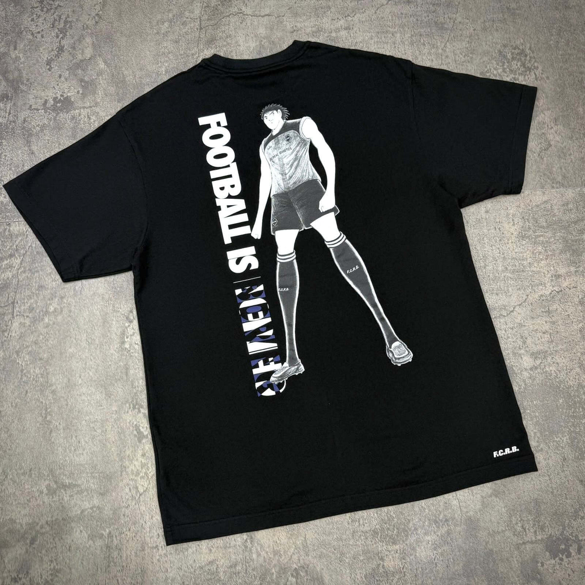 Kojiro Hyuga x F.C.Real Bristol On The Back Tee showcasing football themed design and character on a black tee.