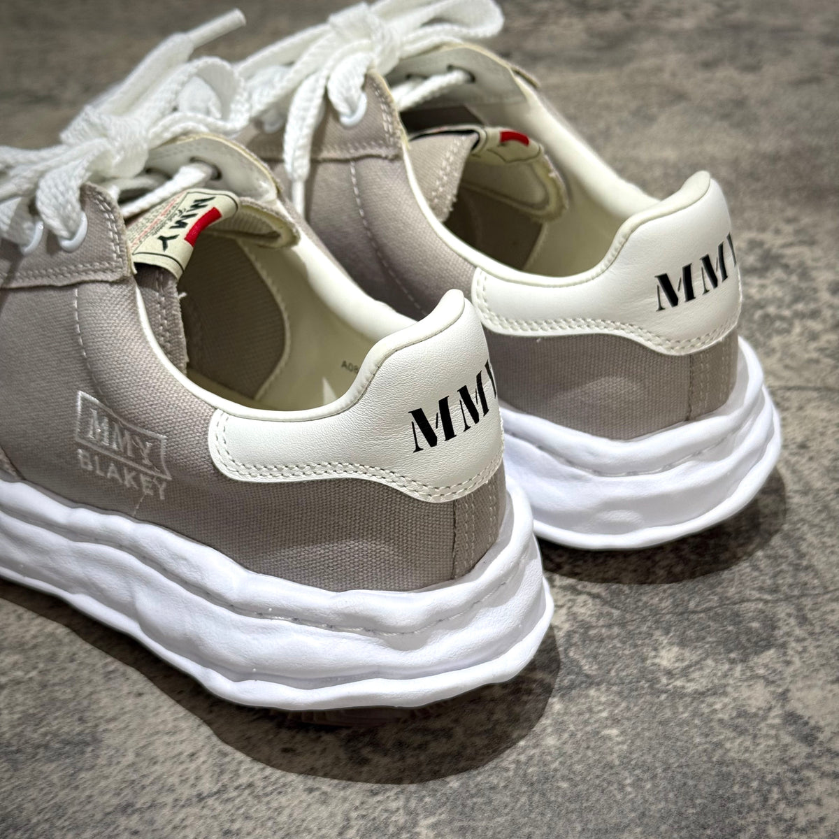MMY BLAKEY OG Canvas - Gray sneakers showing rear view with logo and design details.
