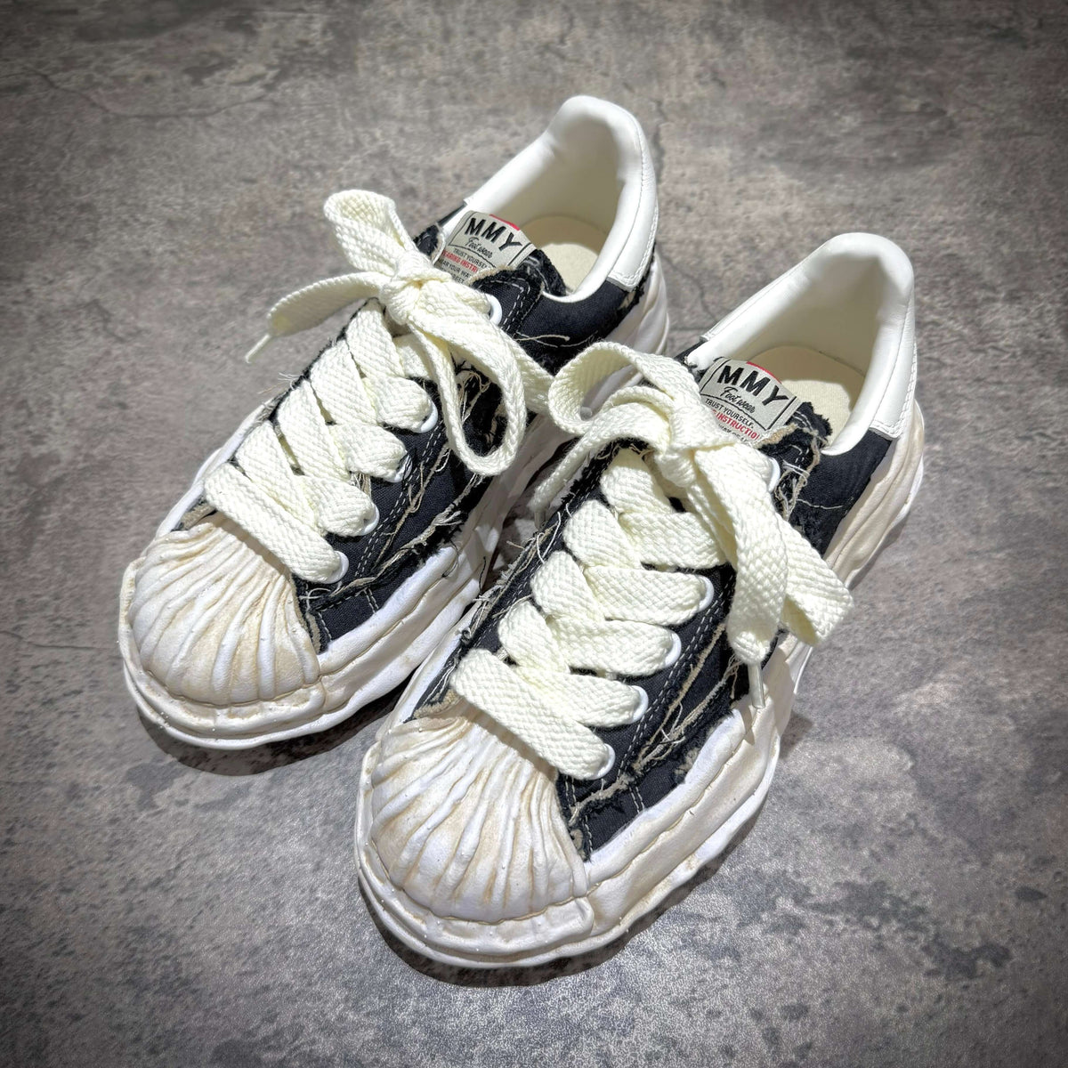 MMY Blakey Canvas Ripped Overdye Low - Black, front view of black canvas sneakers with white laces.