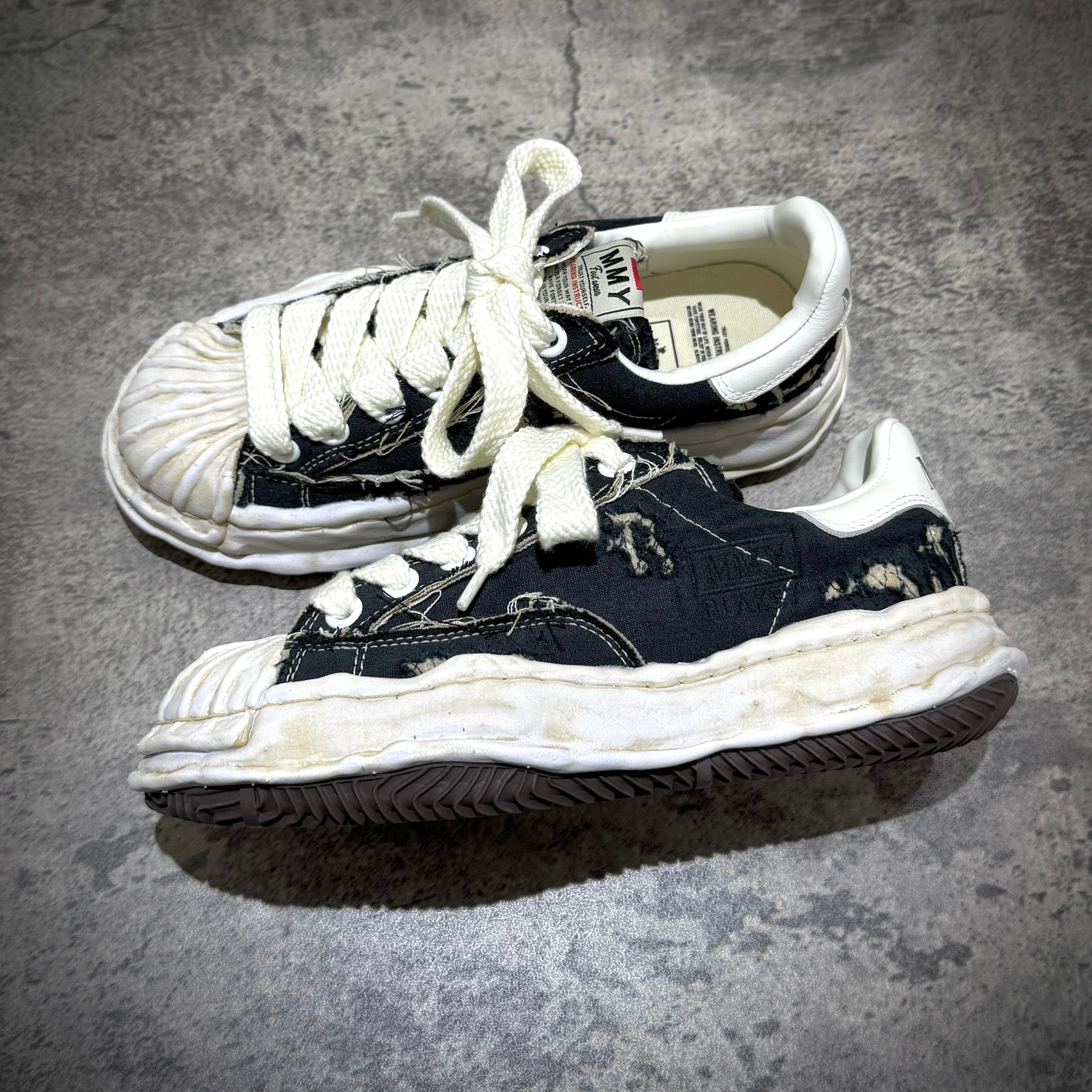 MMY Blakey Canvas Ripped Overdye Low - Black A16FW729 displayed from the top on a textured surface.