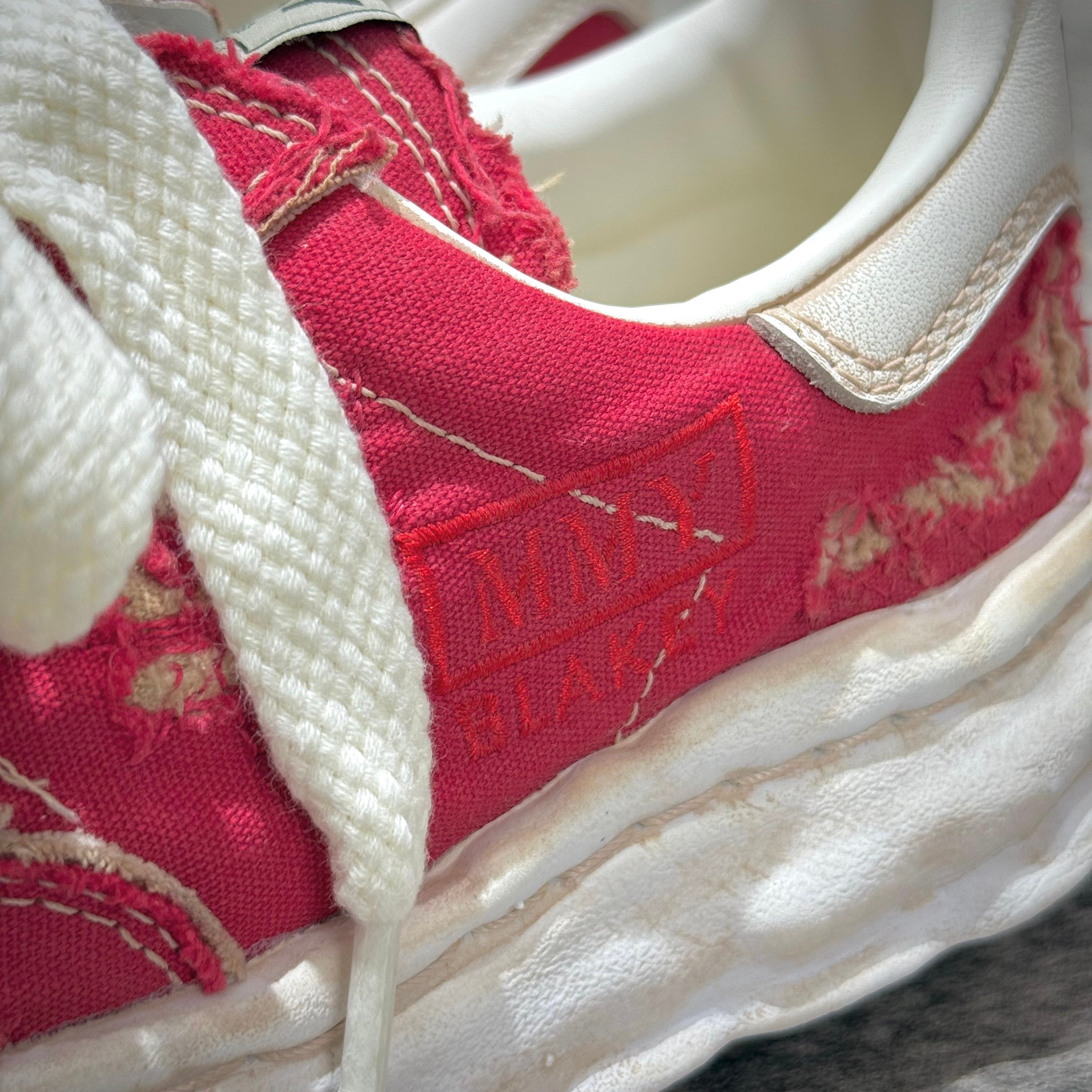 Close-up of MMY Blakey Canvas Ripped Overdye Low - Red A16FW729 showcasing details and texture.