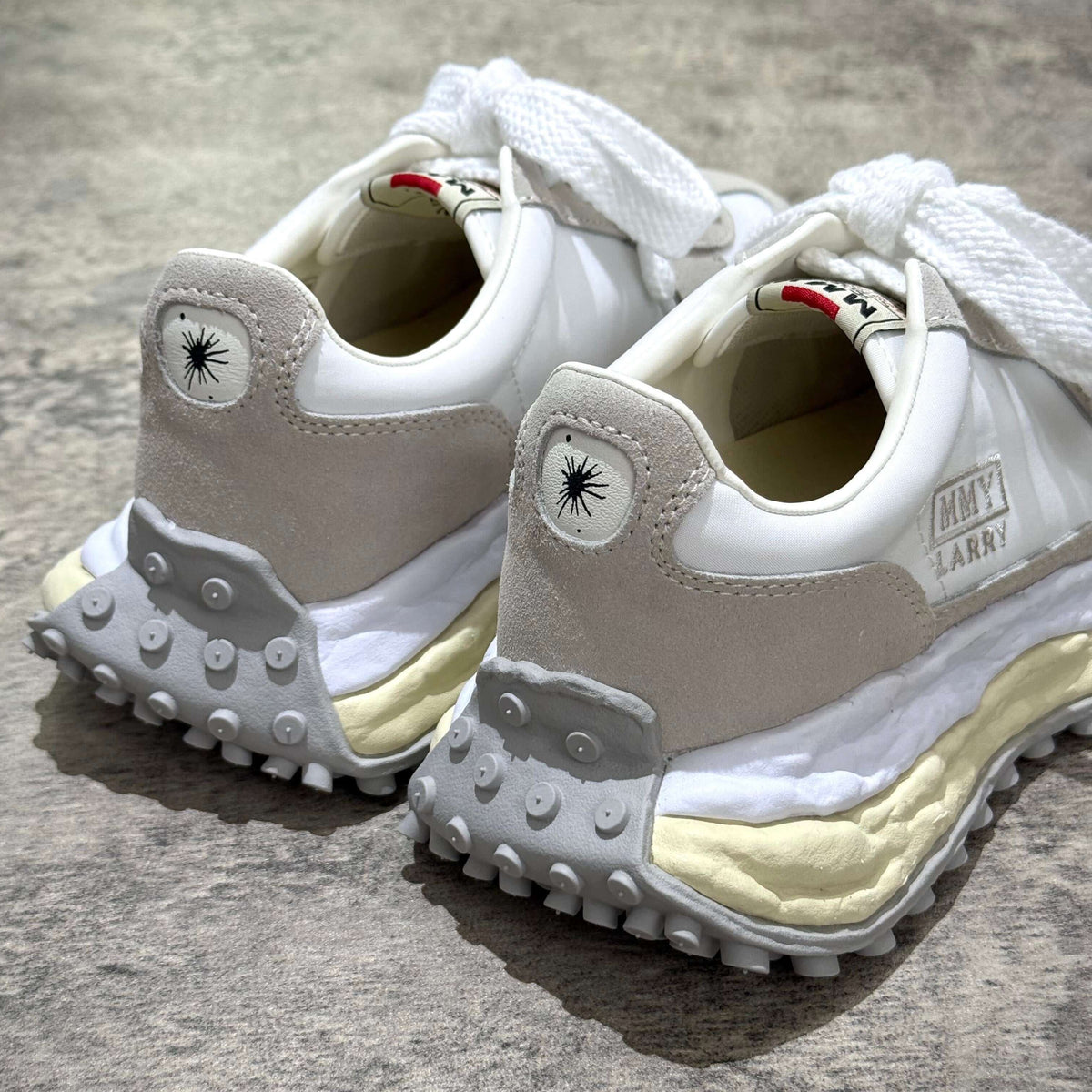 MMY Larry Leather Low - White sneaker back view showcasing oversized design and detailed stitching.