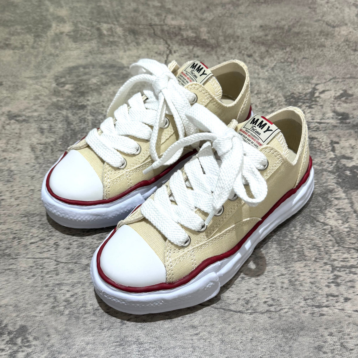 MMY PETERSON OG Canvas - Natural oversized sneakers with white laces and red accents on sole.