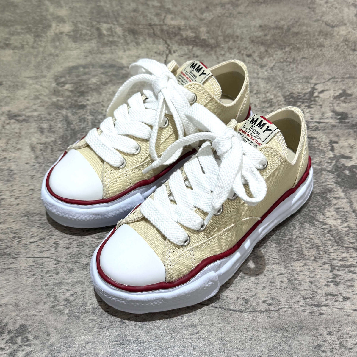 MMY PETERSON OG Canvas - Natural oversized sneakers with white laces and red accents on sole.