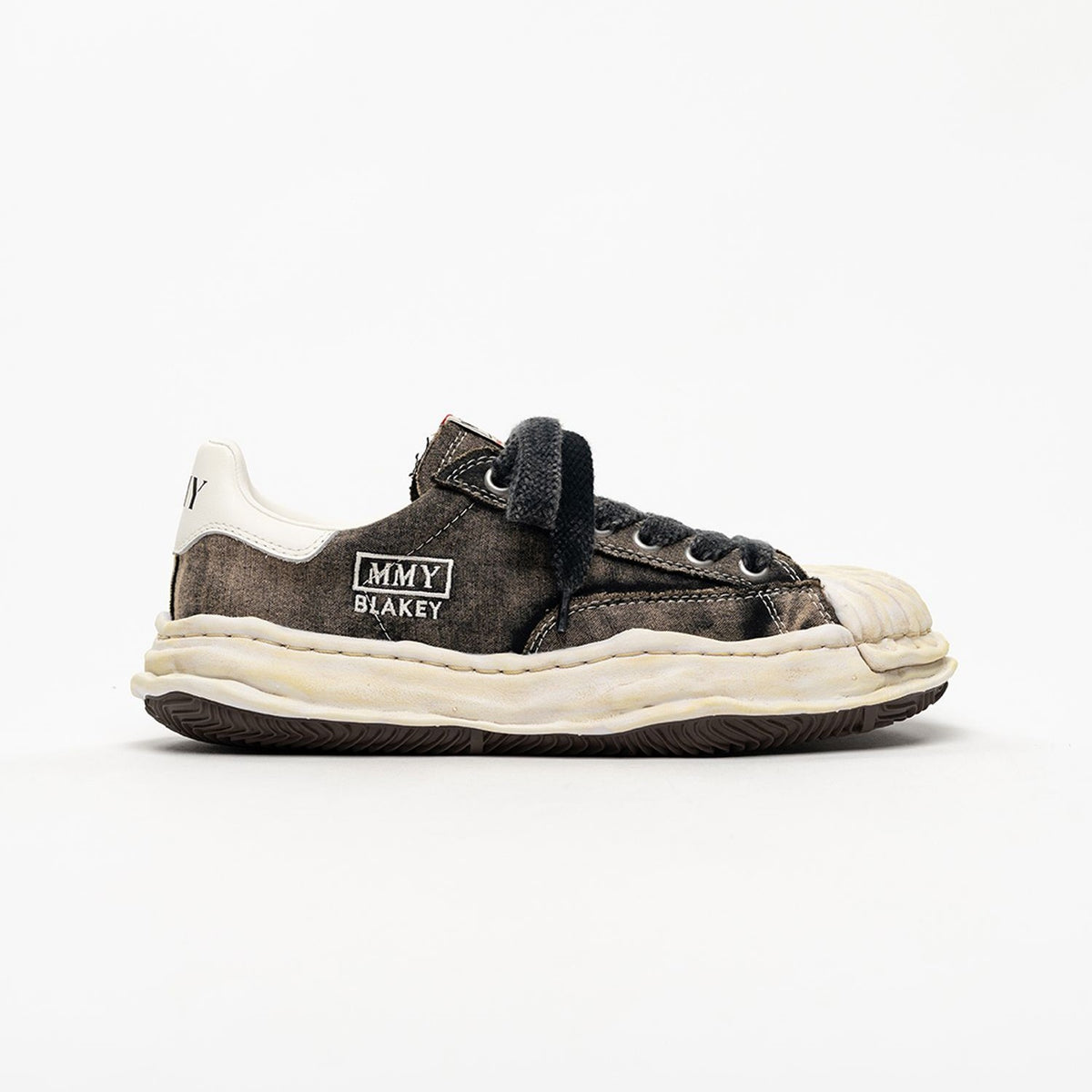 MMY Blakey Bleached Canvas Low - Black A17FW731 sneaker side view with bleached design and rubber sole.