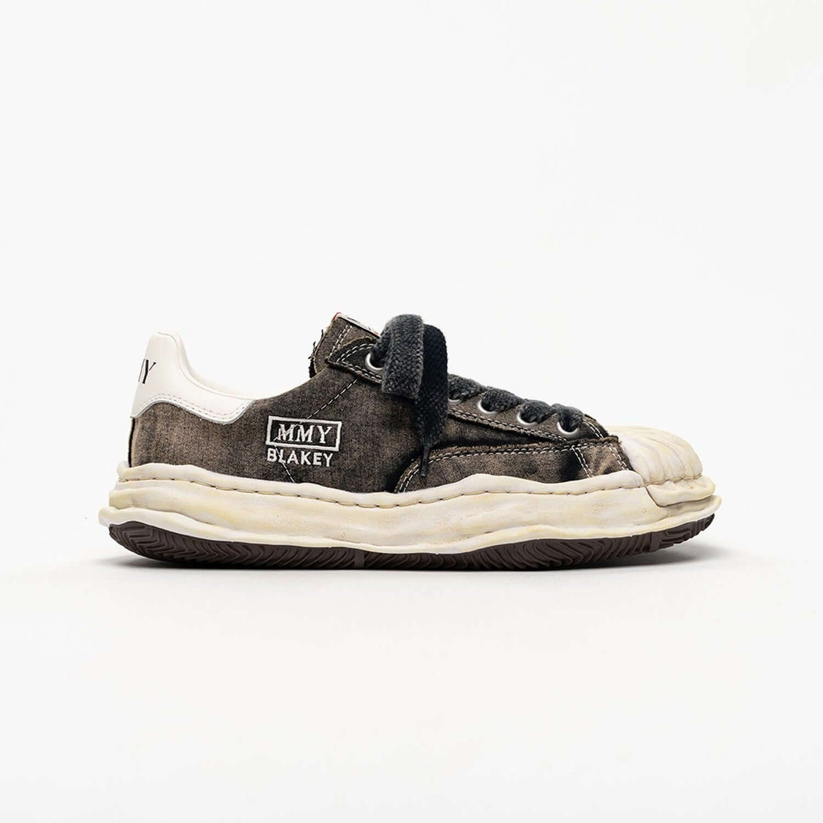 MMY Blakey Bleached Canvas Low - Black A17FW731 sneaker side view with bleached design and rubber sole.