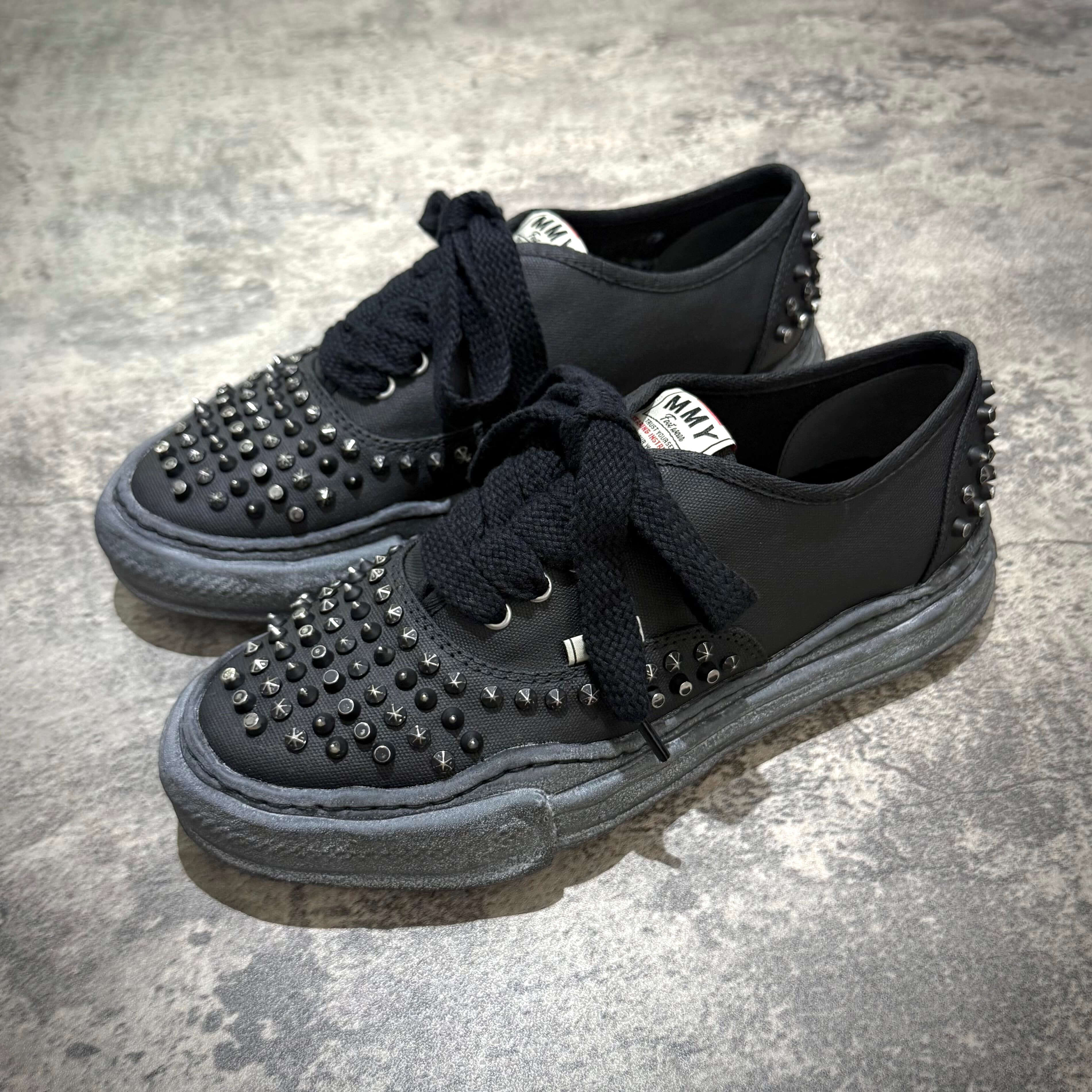 MMY Baker Studded Canvas Low - All Black shoes featuring oversized studded design and black laces.