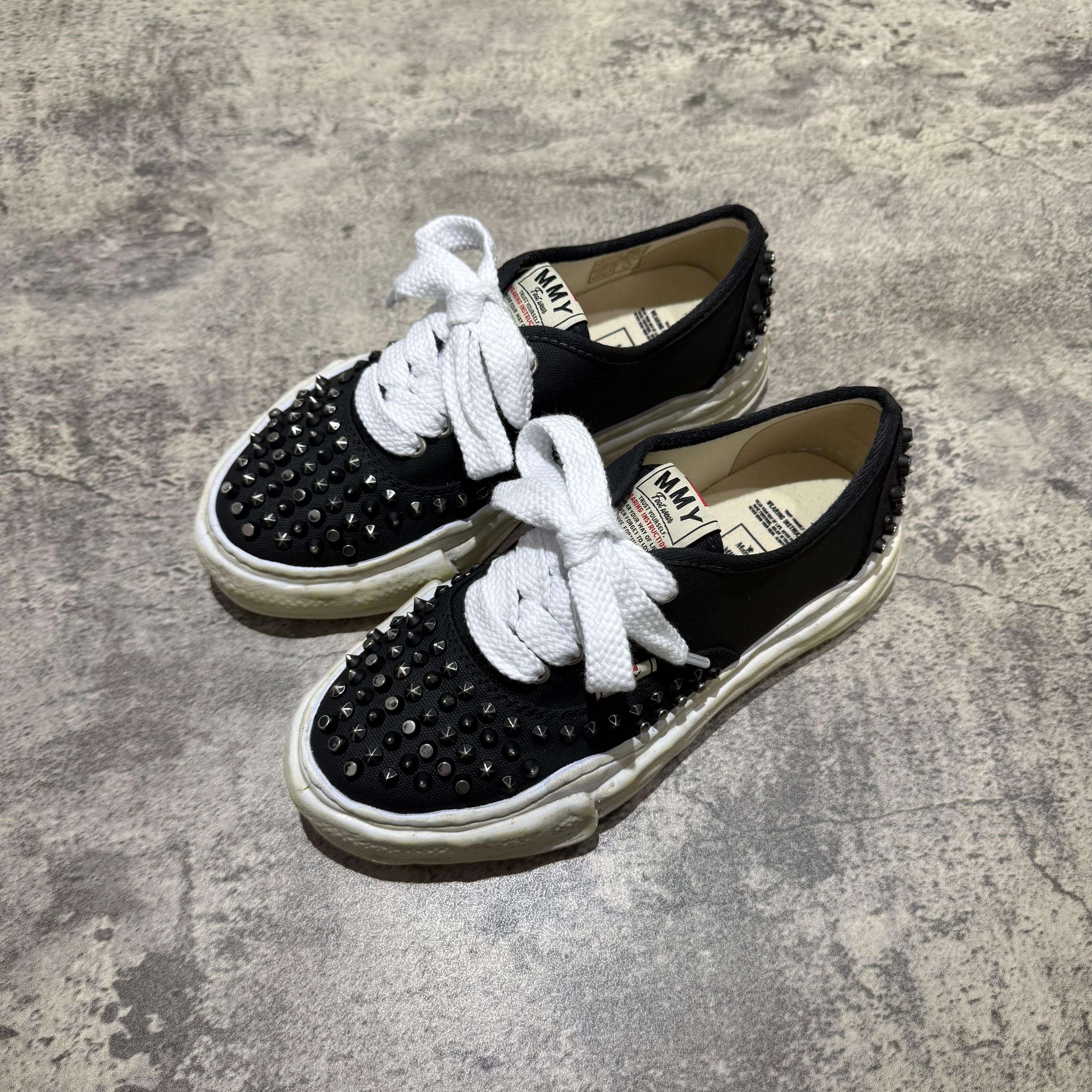 MMY Baker Studded Canvas Low - Black/White with oversized design and white laces, featuring studs for style.