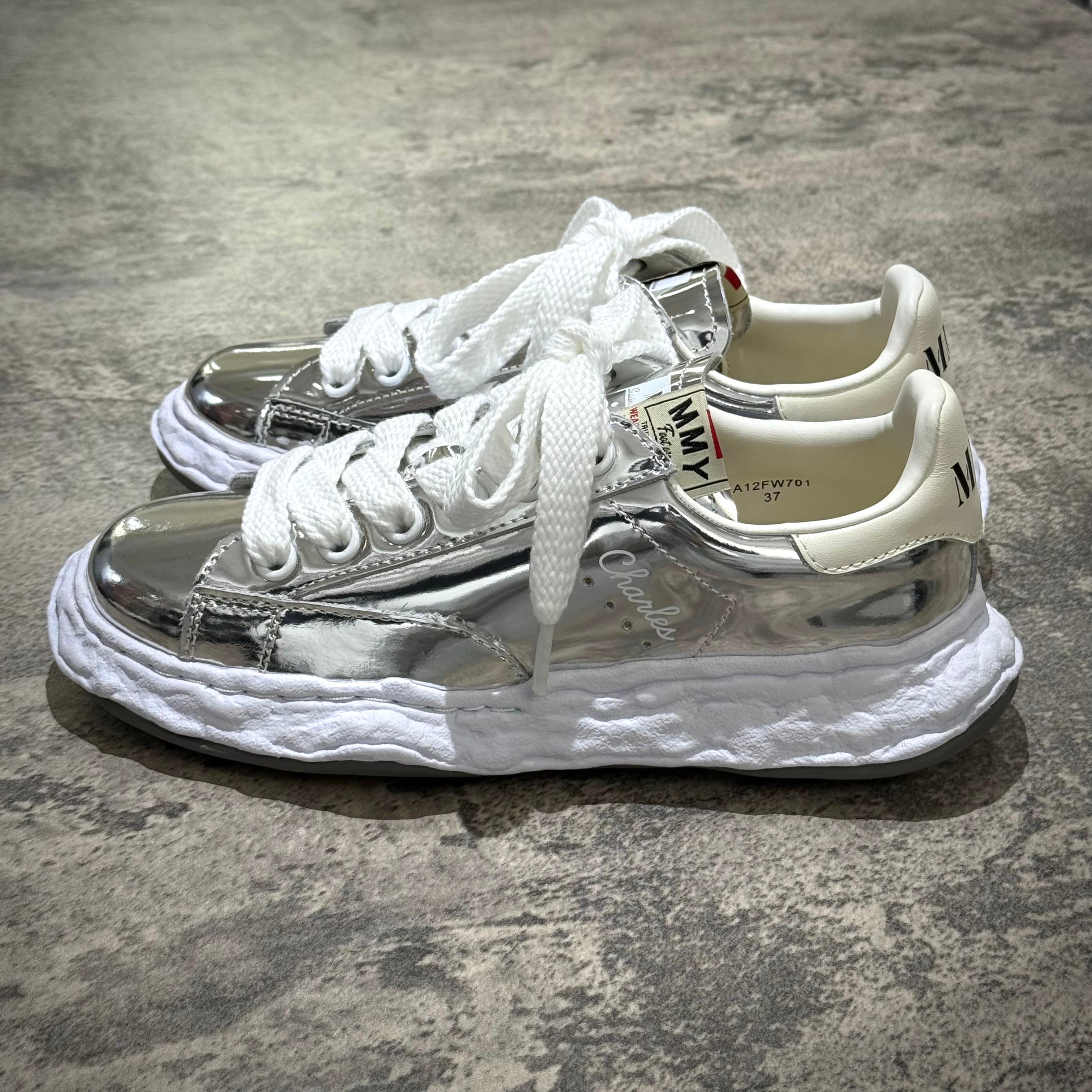 MMY CHARLES OG Sole Leather - Silver stylish sneaker with shiny silver surface and white sole.